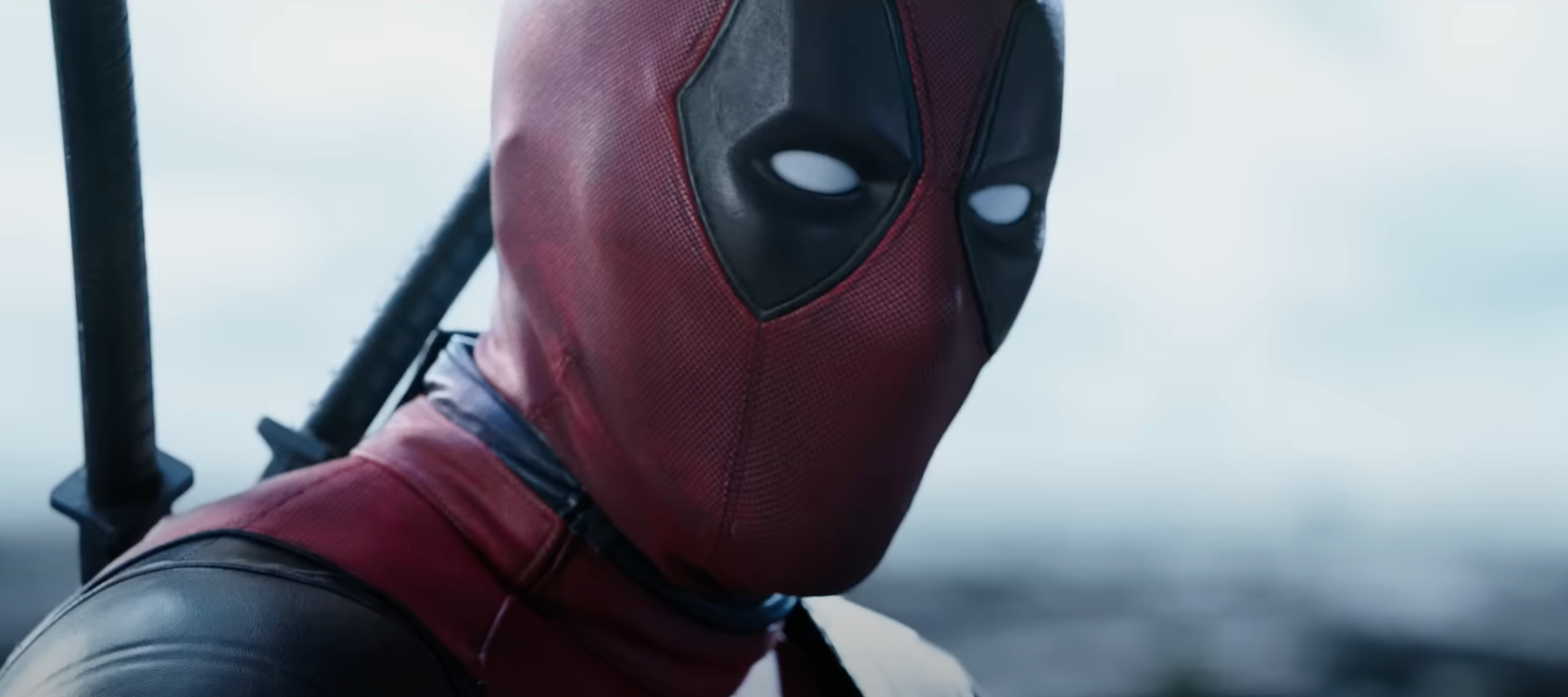 Close-up of Deadpool against a clouded sky