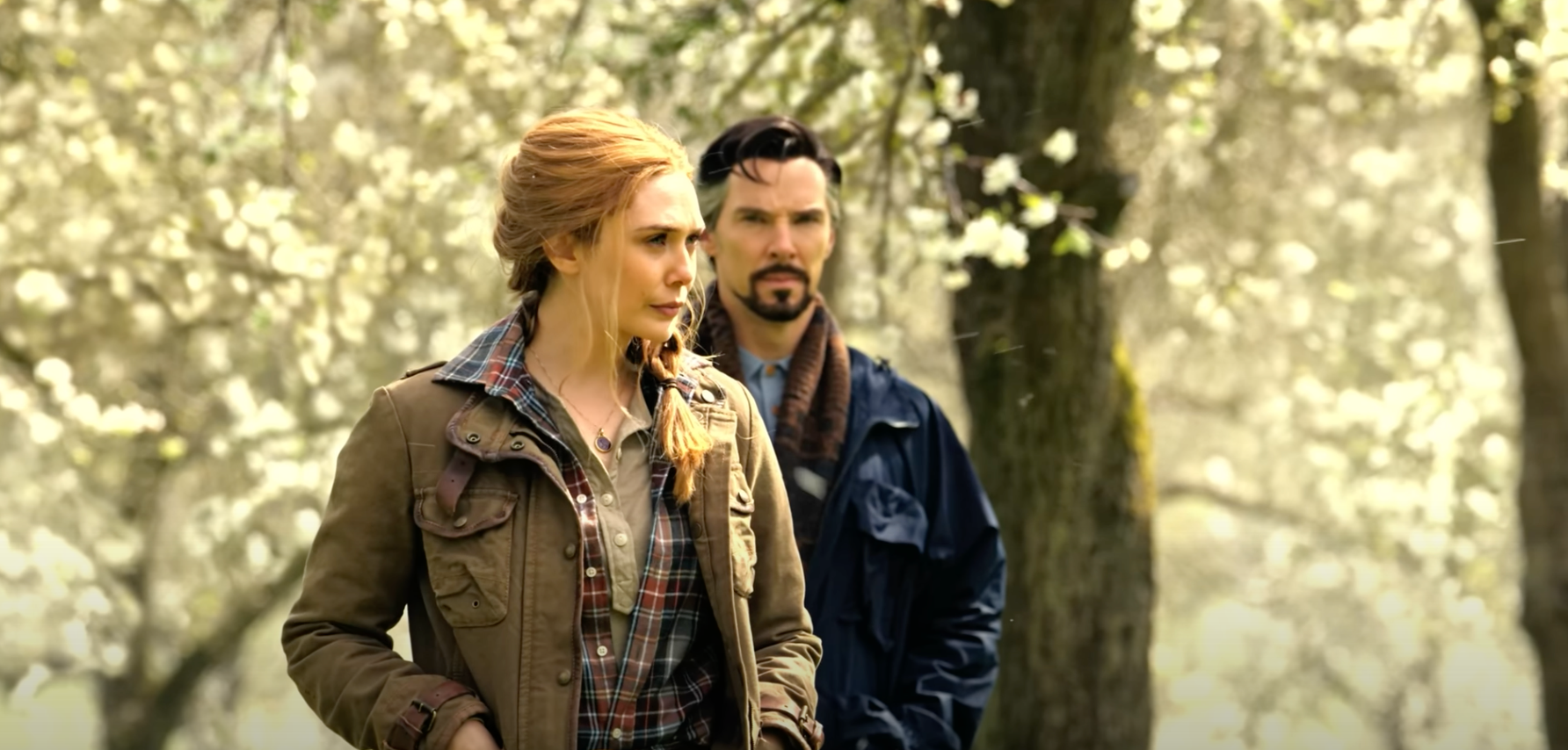 Wanda Maximoff and Dr. Strange walk through a garden in "Doctor Strange in the Multiverse of Madness"