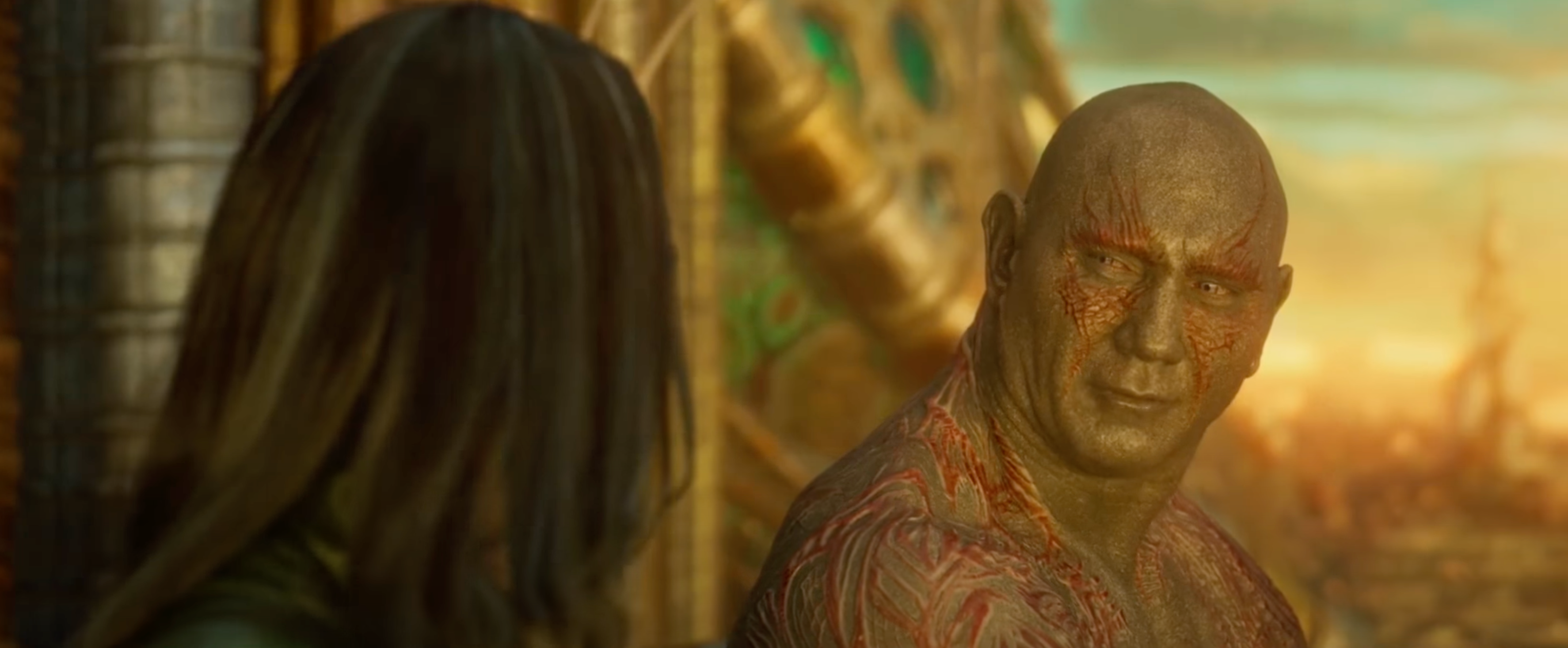 Drax in conversation with Mantis, sitting outside, in "Guardians of the Galaxy Vol. 2"