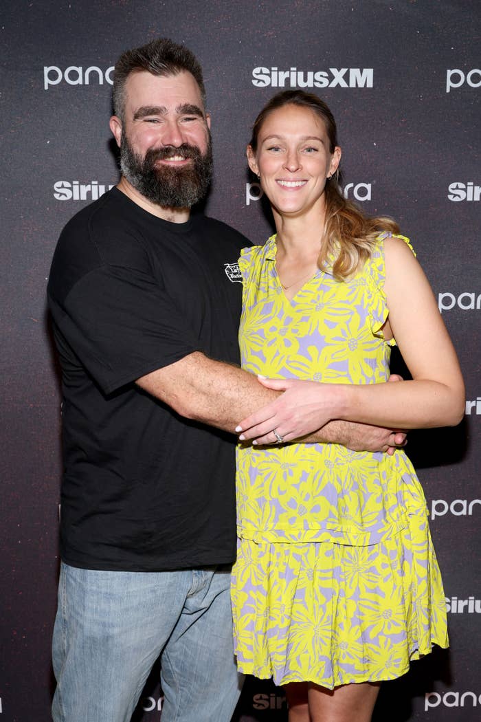 Jason Kelce and Kylie Kelce posing on a red carpet