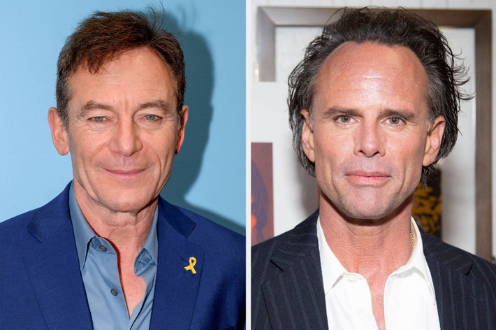 Two men in suits at a formal event. The man on the left wears a blue suit with a yellow ribbon, and the man on the right wears a black pinstripe suit