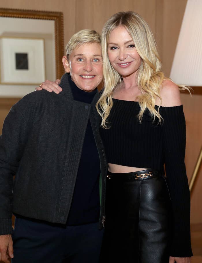 Ellen DeGeneres and Portia de Rossi smiling at an event