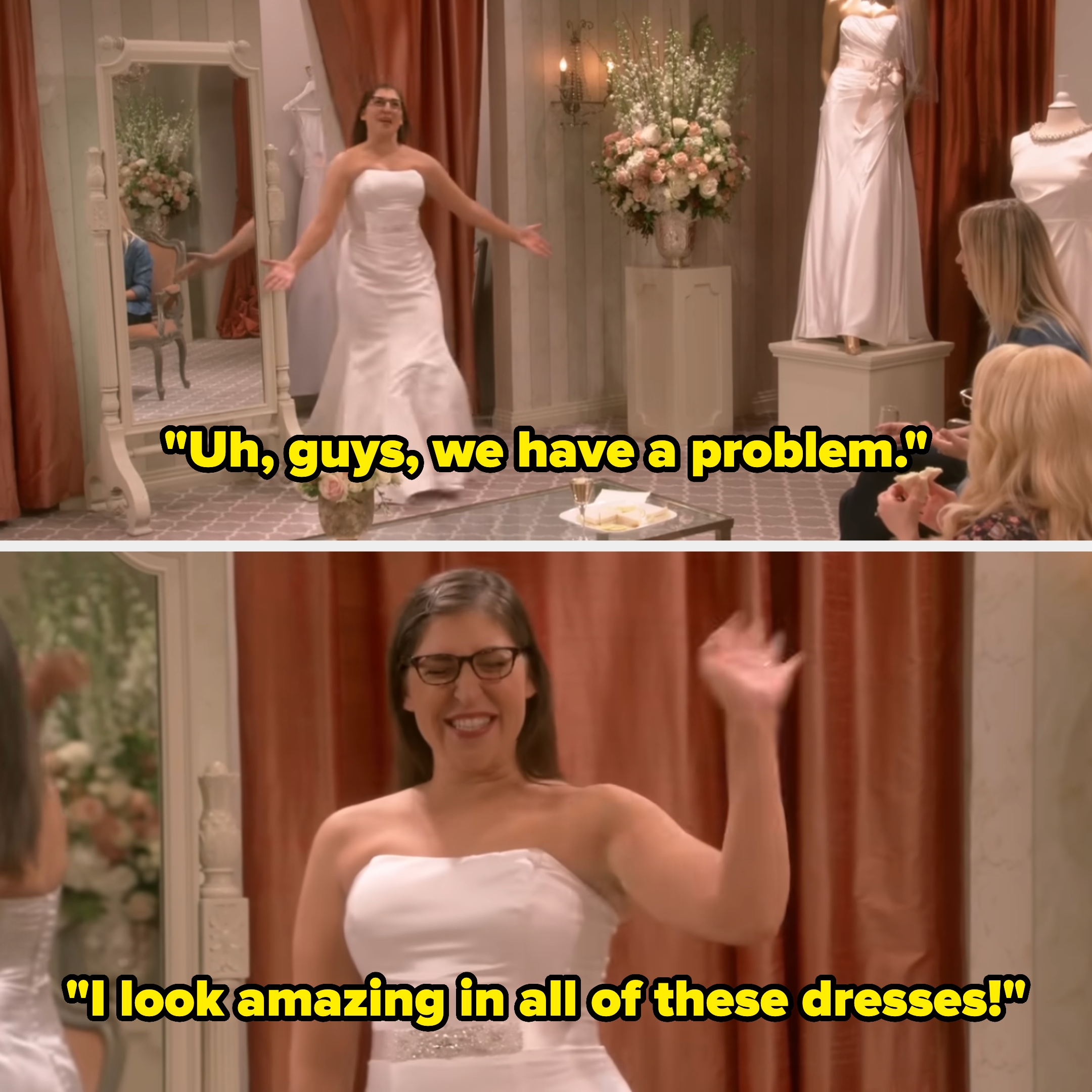 Woman in strapless wedding dress smiles and waves in bridal shop, surrounded by friends and floral decor