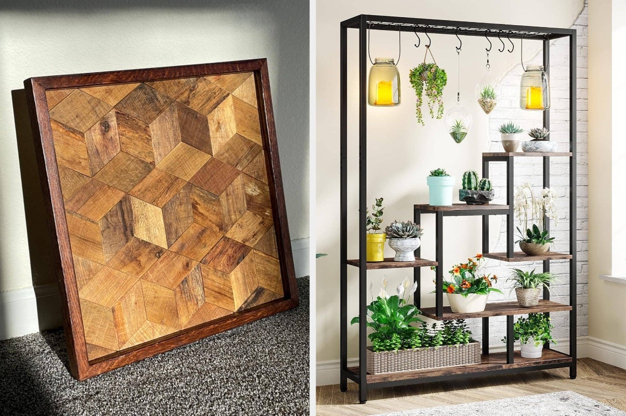 Decor items: A wooden geometric wall art leaning against a wall and a metal shelf stand with hanging lights and potted plants in a bright room