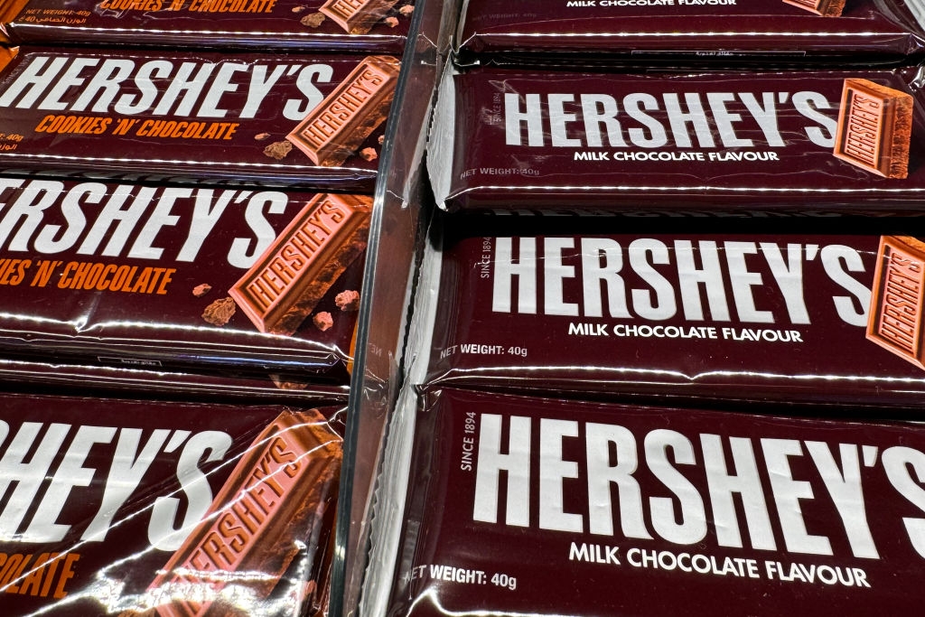 Hershey's chocolate bars displayed in rows, including &quot;Cookies 'N' Chocolate&quot; and &quot;Milk Chocolate Flavour&quot; varieties