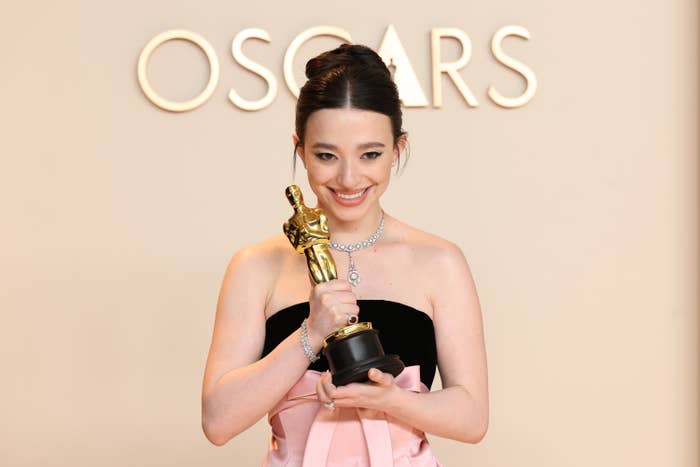 Mikey Madison holding her Oscar