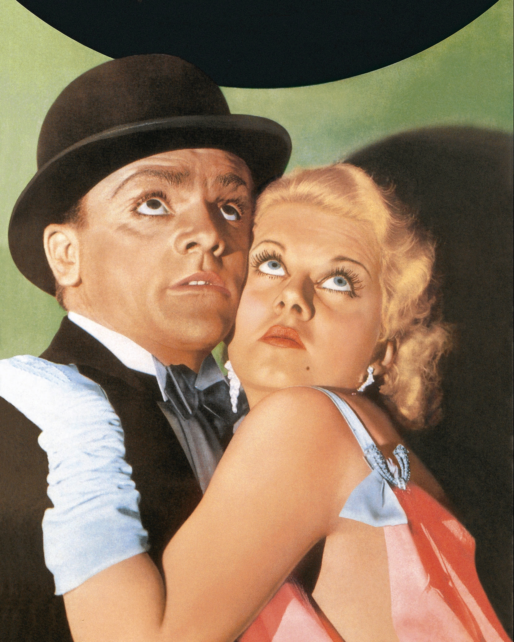 Classic movie poster: Two actors in 1930s attire look upward dramatically; the man in a suit and bowler hat, the woman in a glamorous gown