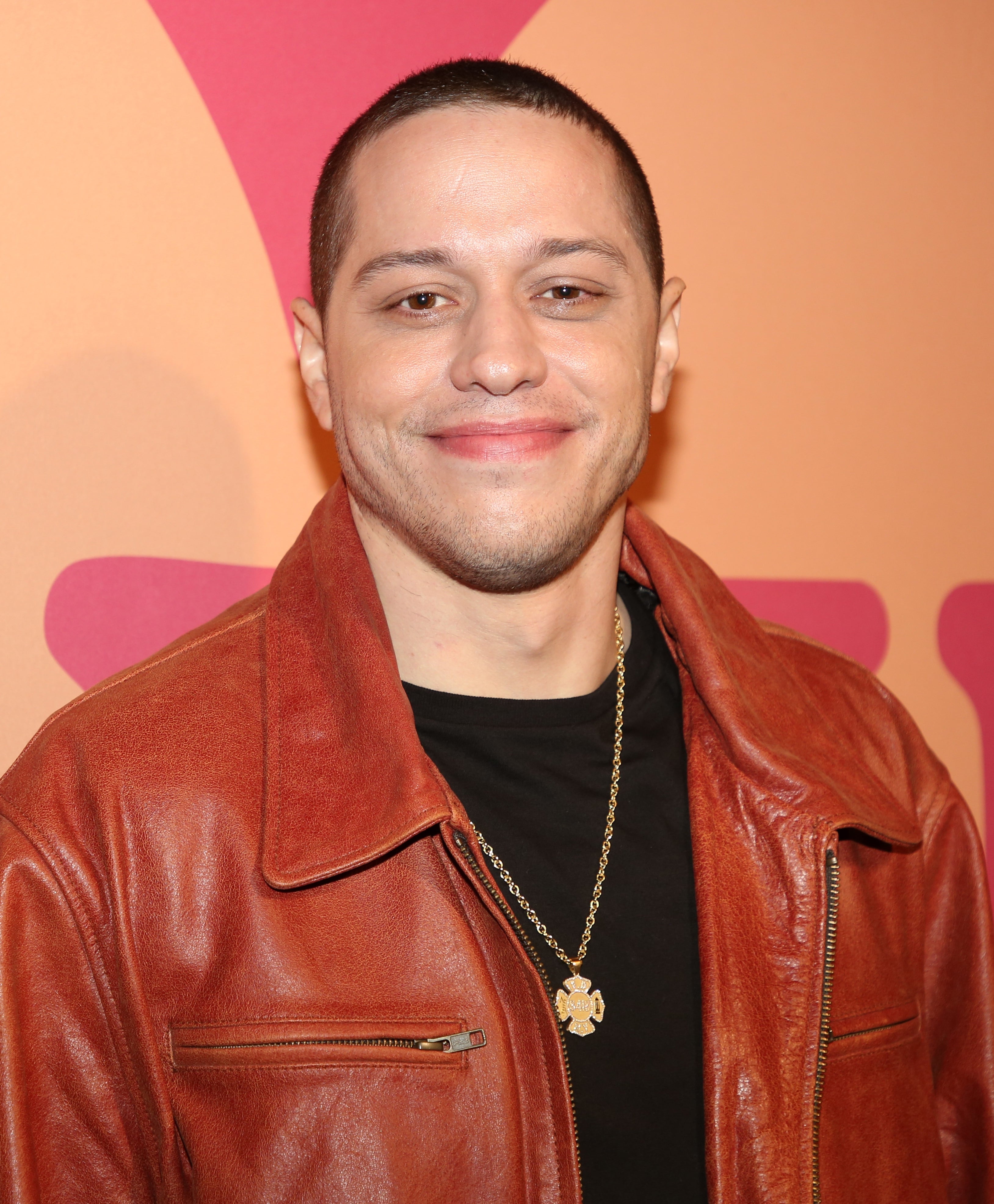 Pete Davidson smiling at an event