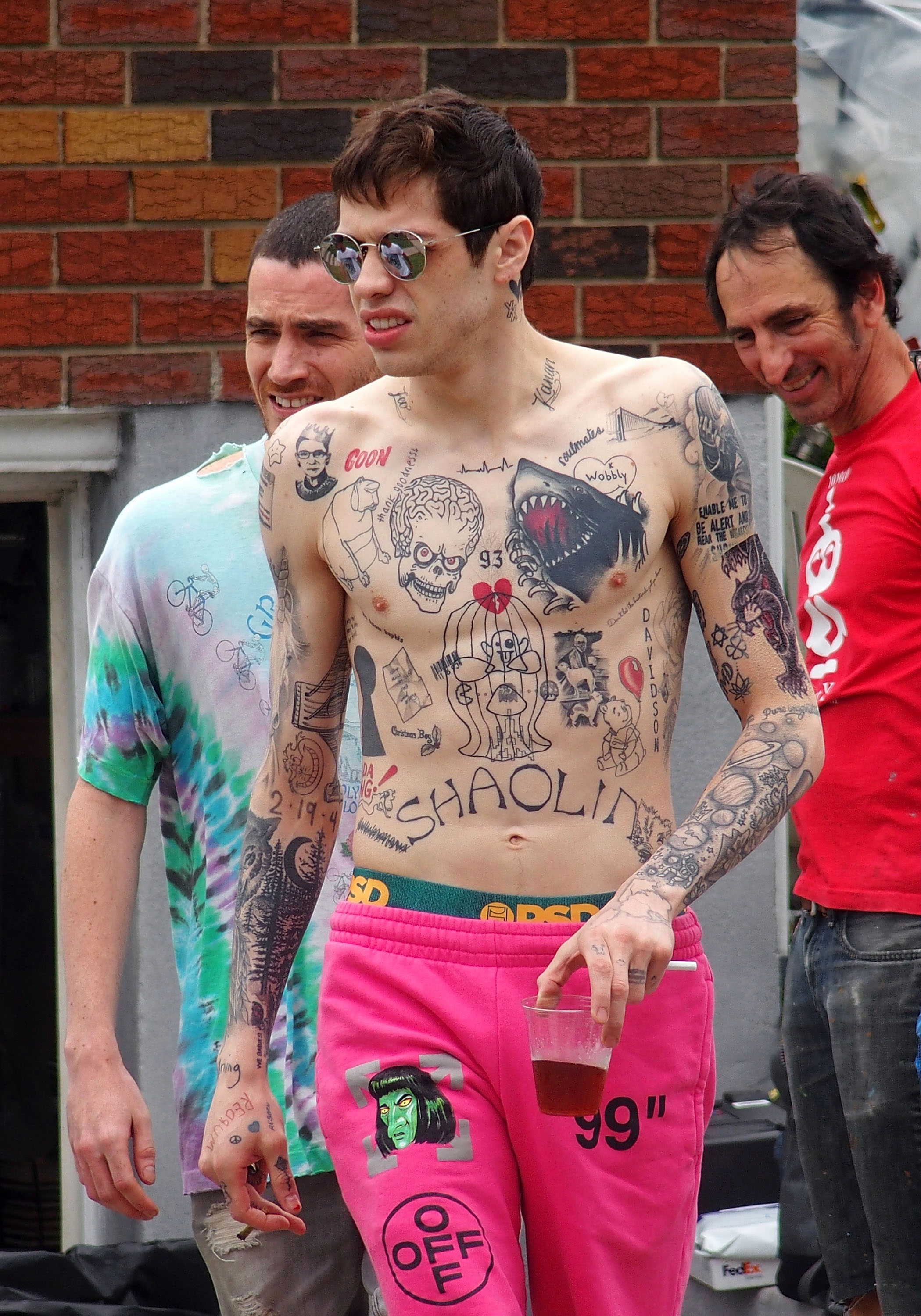 Pete Davidson topless showing many tattoos