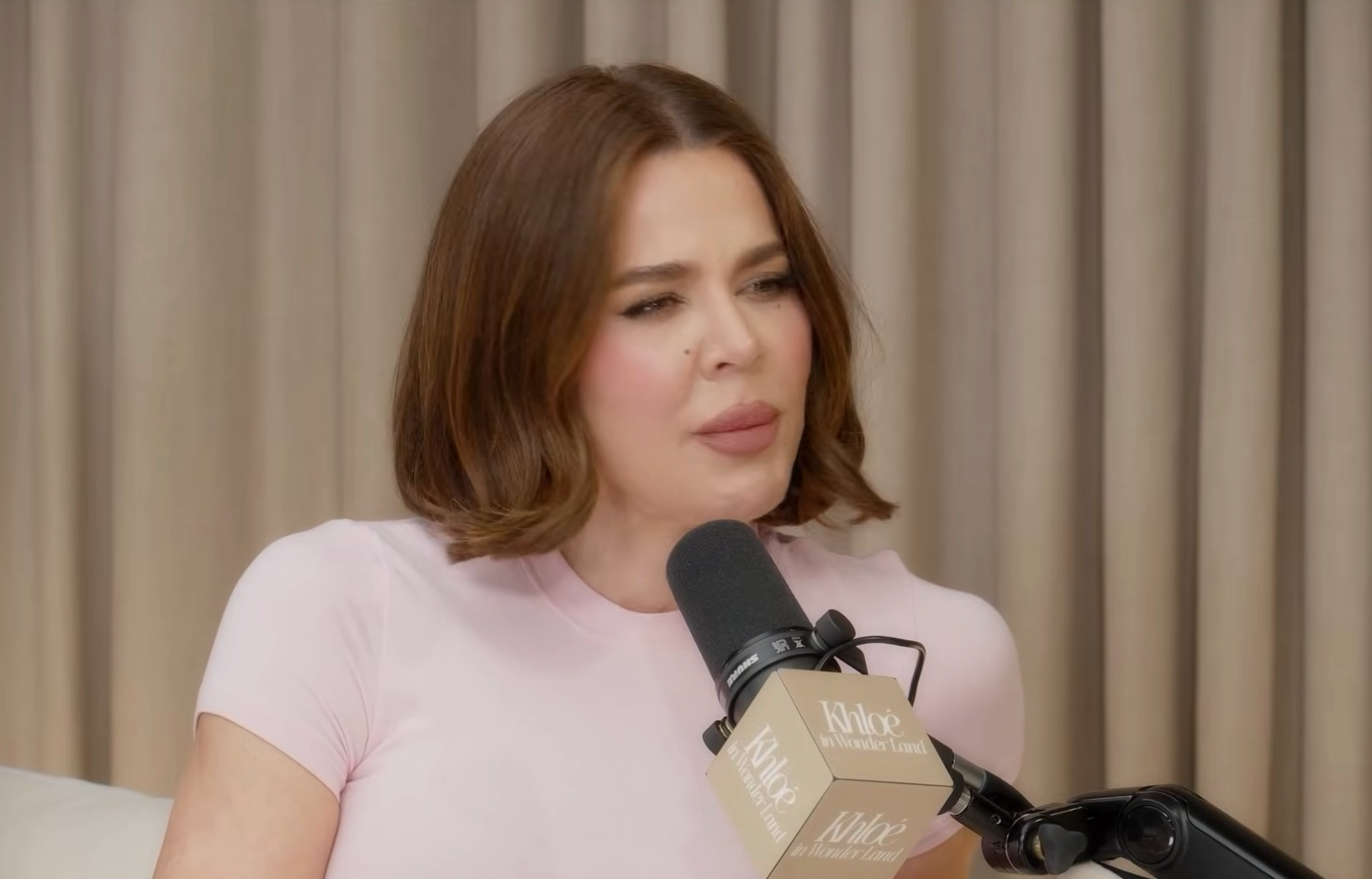 Khloé Kardashian speaking on a podcast