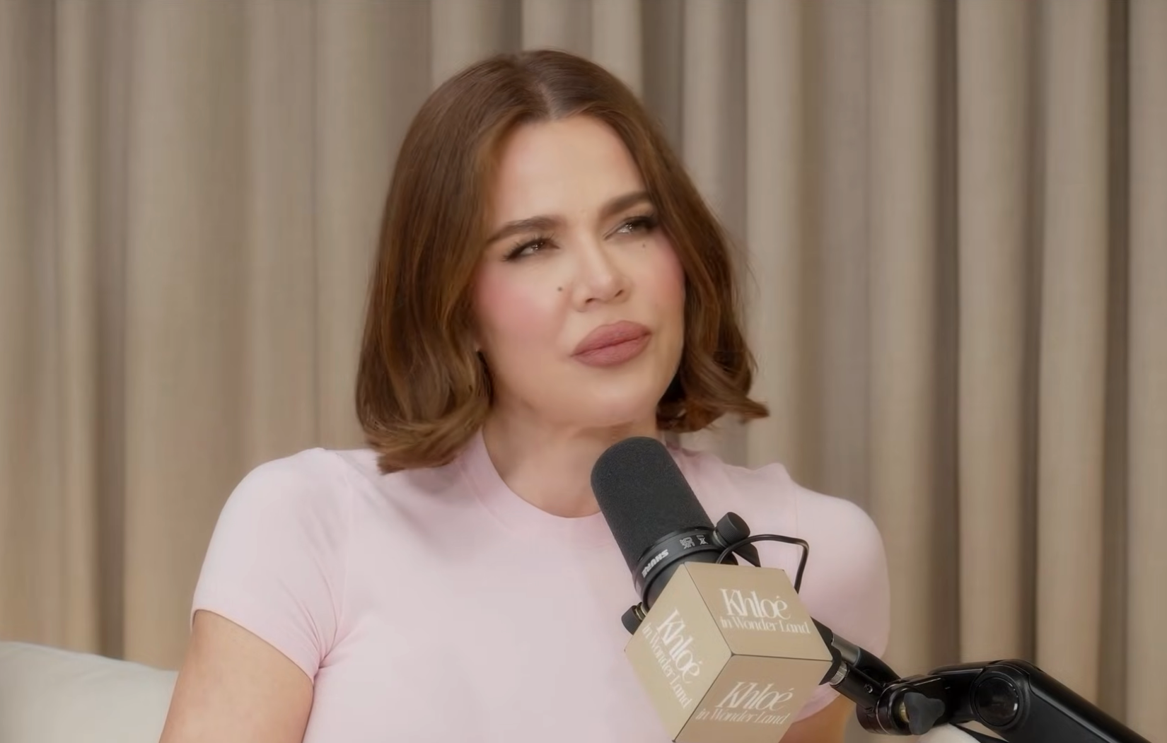 Khloé Kardashian speaking on a podcast