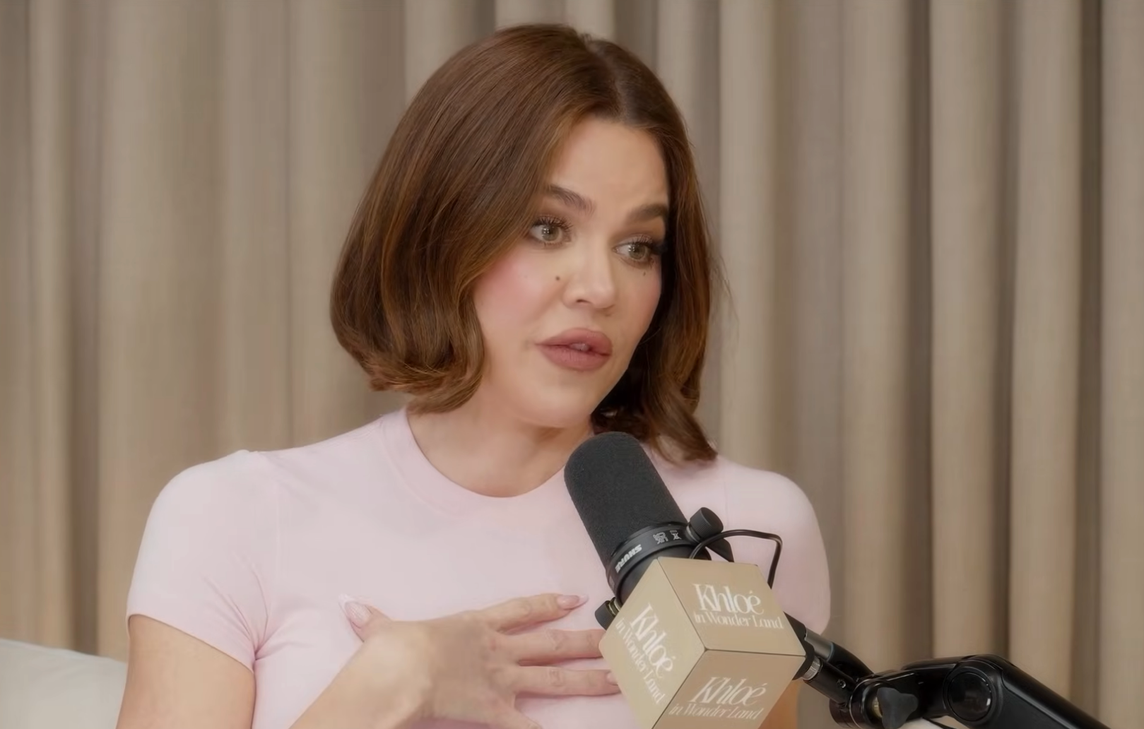 Khloé Kardashian speaking on a podcast