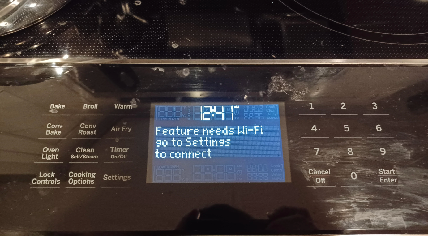 Digital oven display showing: "Feature needs Wi-Fi, go to Settings to connect." Time displayed is 12:41