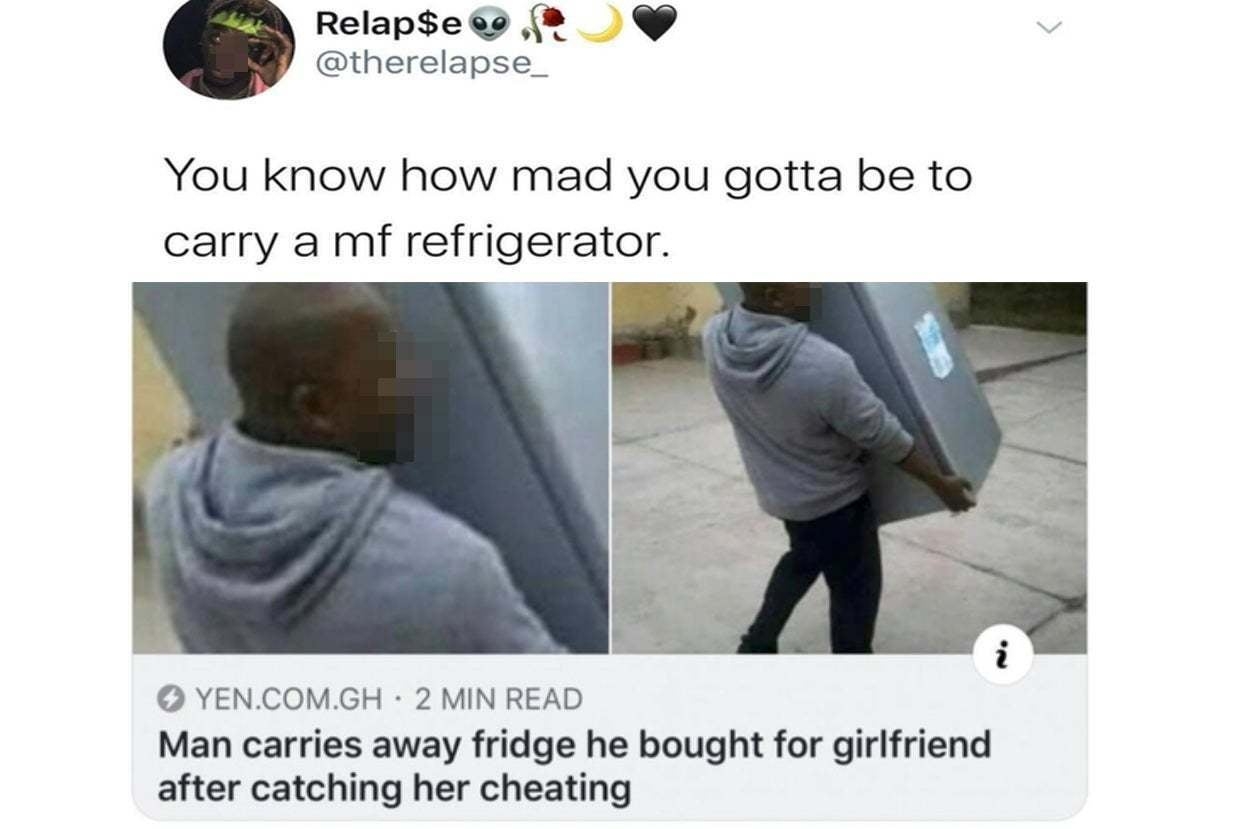 Tweet showing a man carrying a refrigerator, captioned about catching a girlfriend cheating