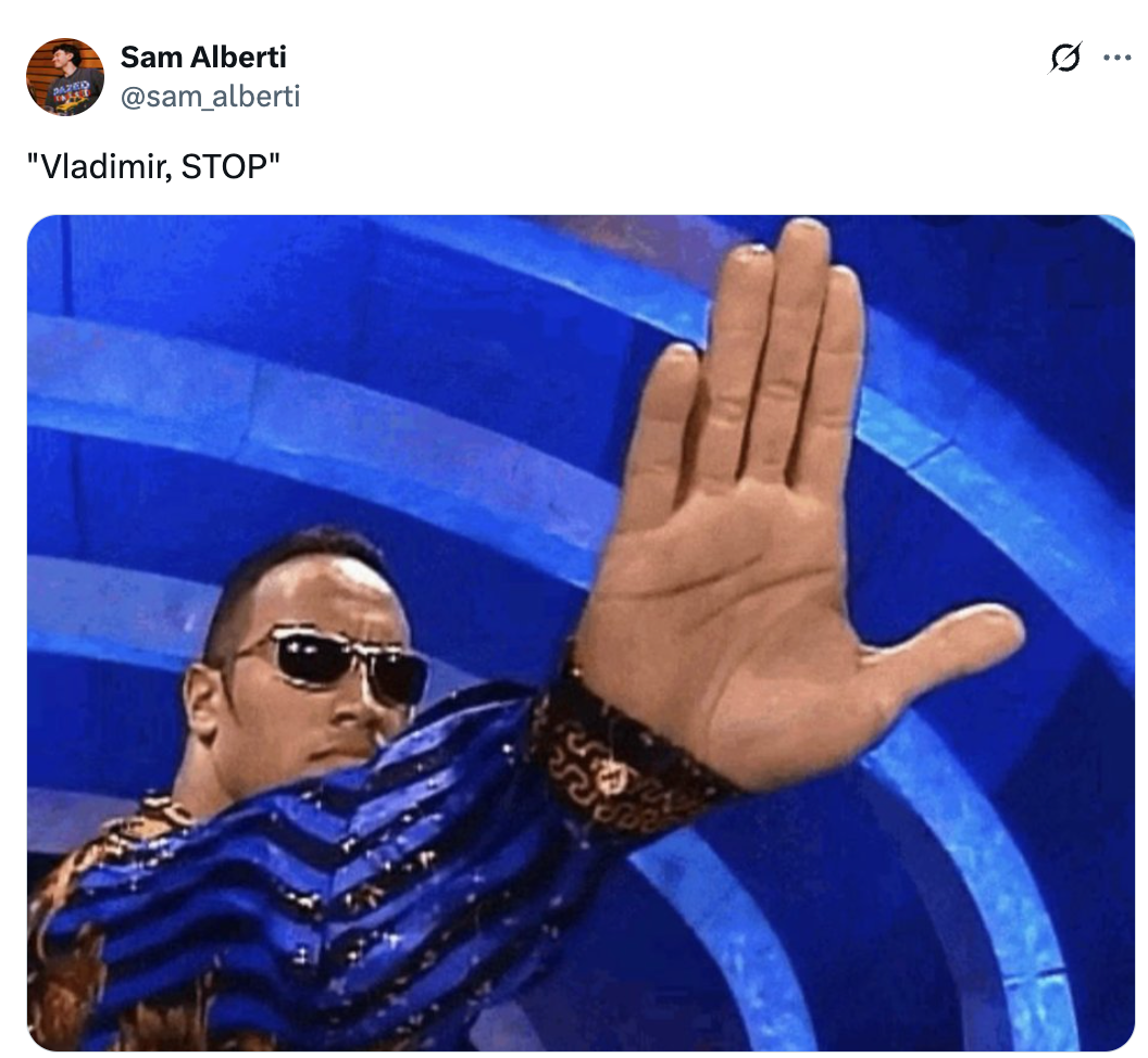 A person wearing sunglasses and a striped shirt holds up their hand, gesturing to stop, with the caption &quot;Vladimir, STOP.&quot;