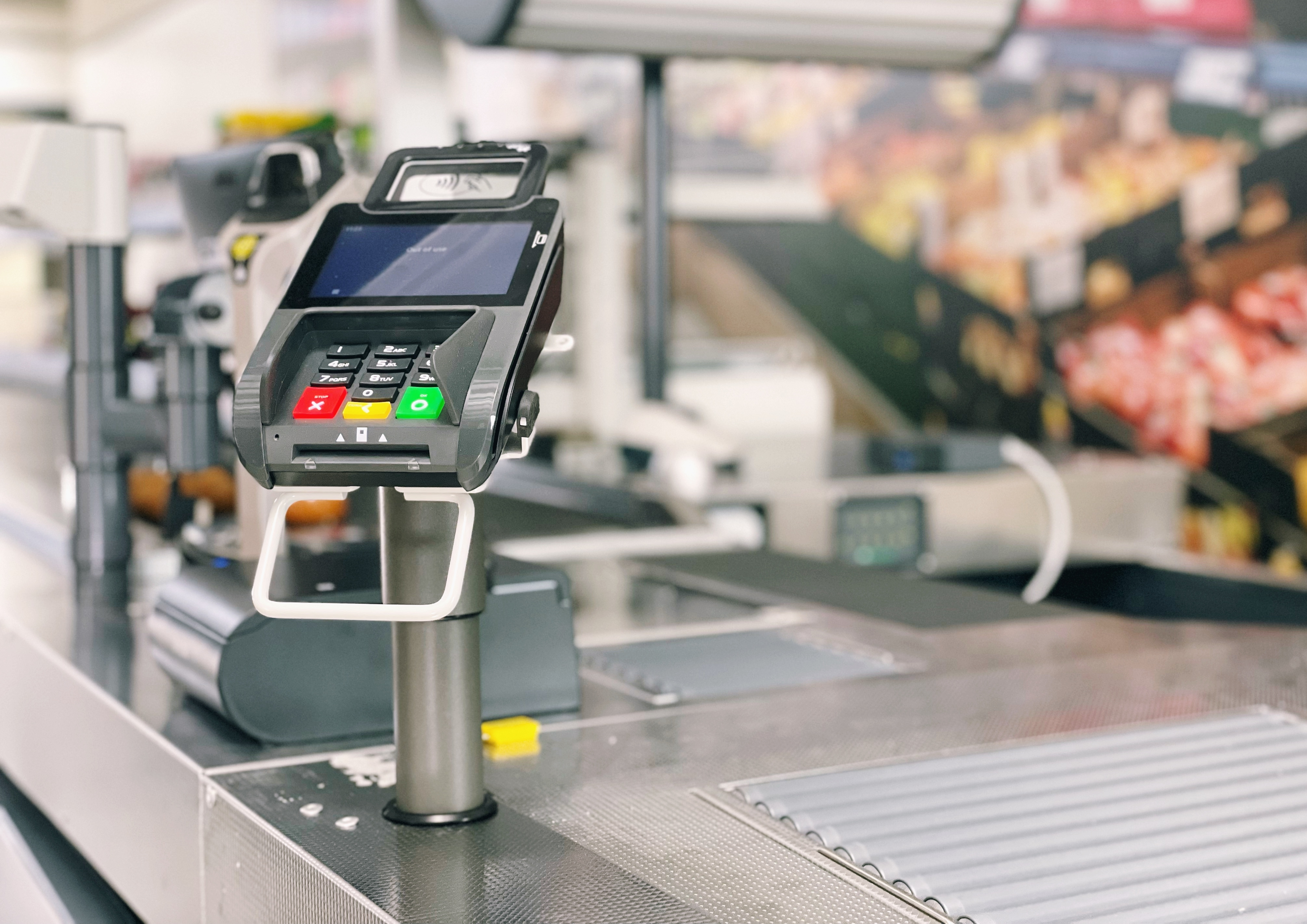 Credit card terminal on a checkout counter in a store setting