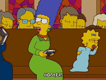 Animated scene of Marge Simpson looking back and shouting &quot;Homer!&quot; while holding a book in church. Baby Maggie sits beside her with a pacifier