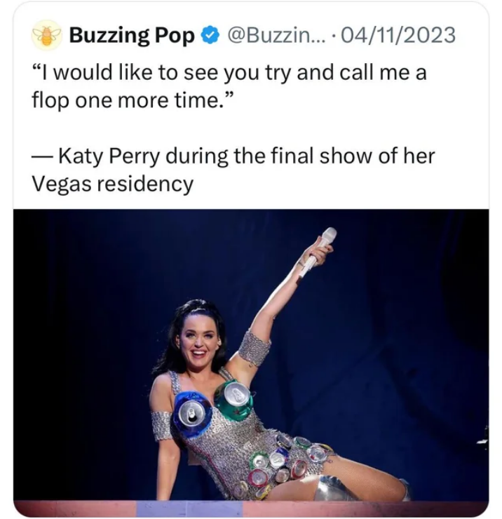 Katy Perry performs on stage with quote: "I would like to see you try and call me a flop one more time"