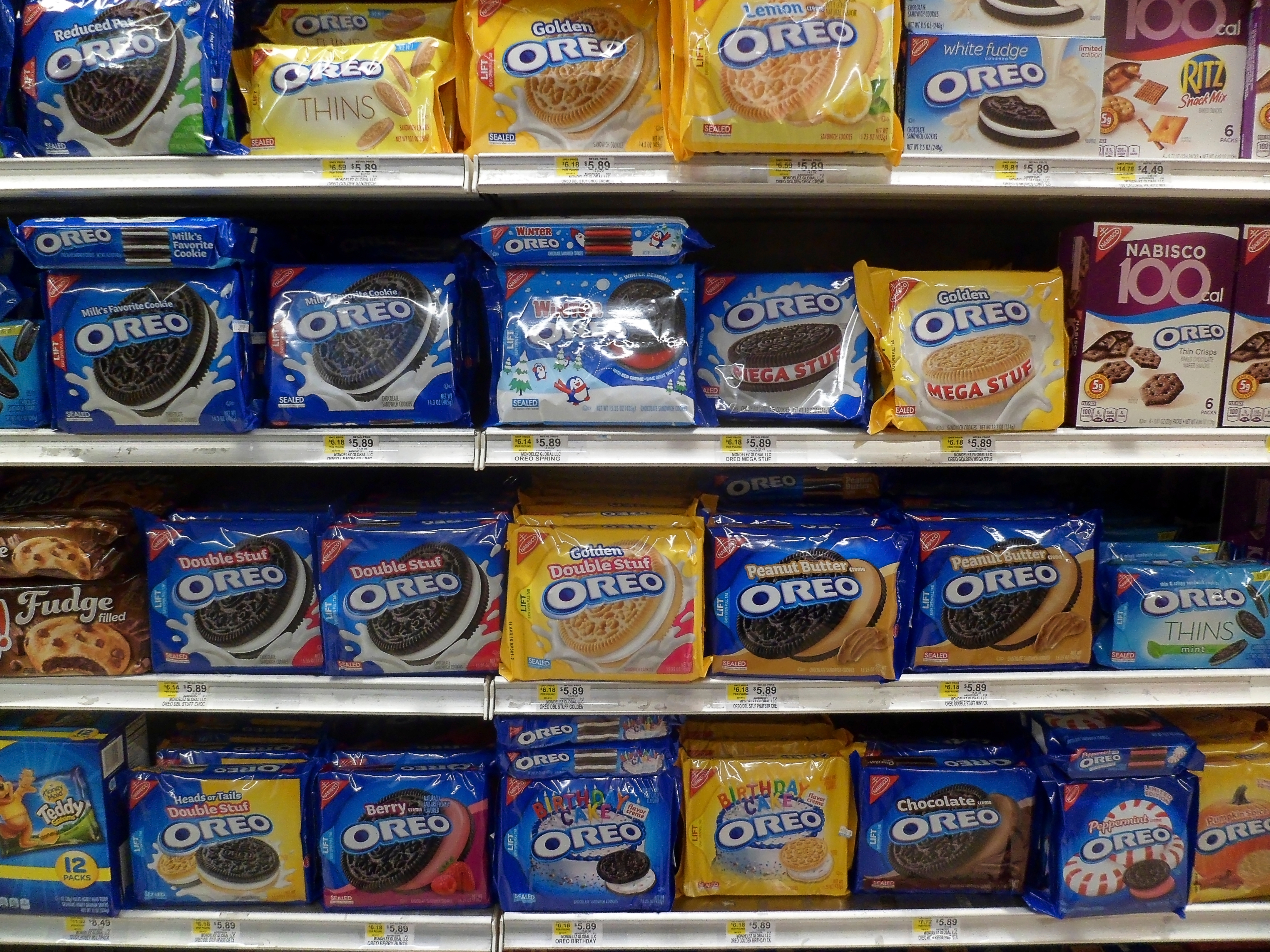 Store shelves filled with various Oreo cookie packages, each featuring different flavors and package designs