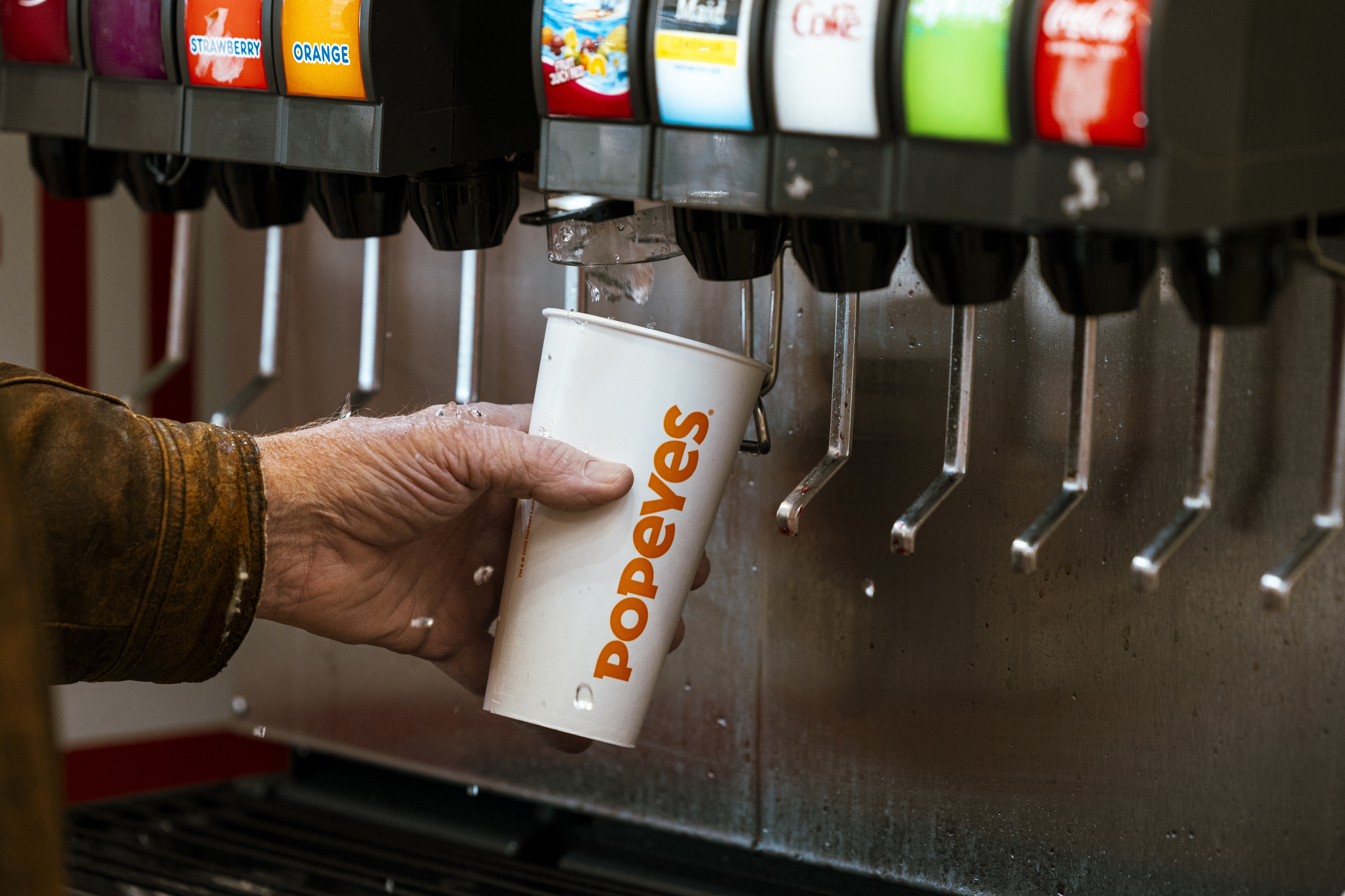 A Pepsi fountain drink machine with multiple soda options available