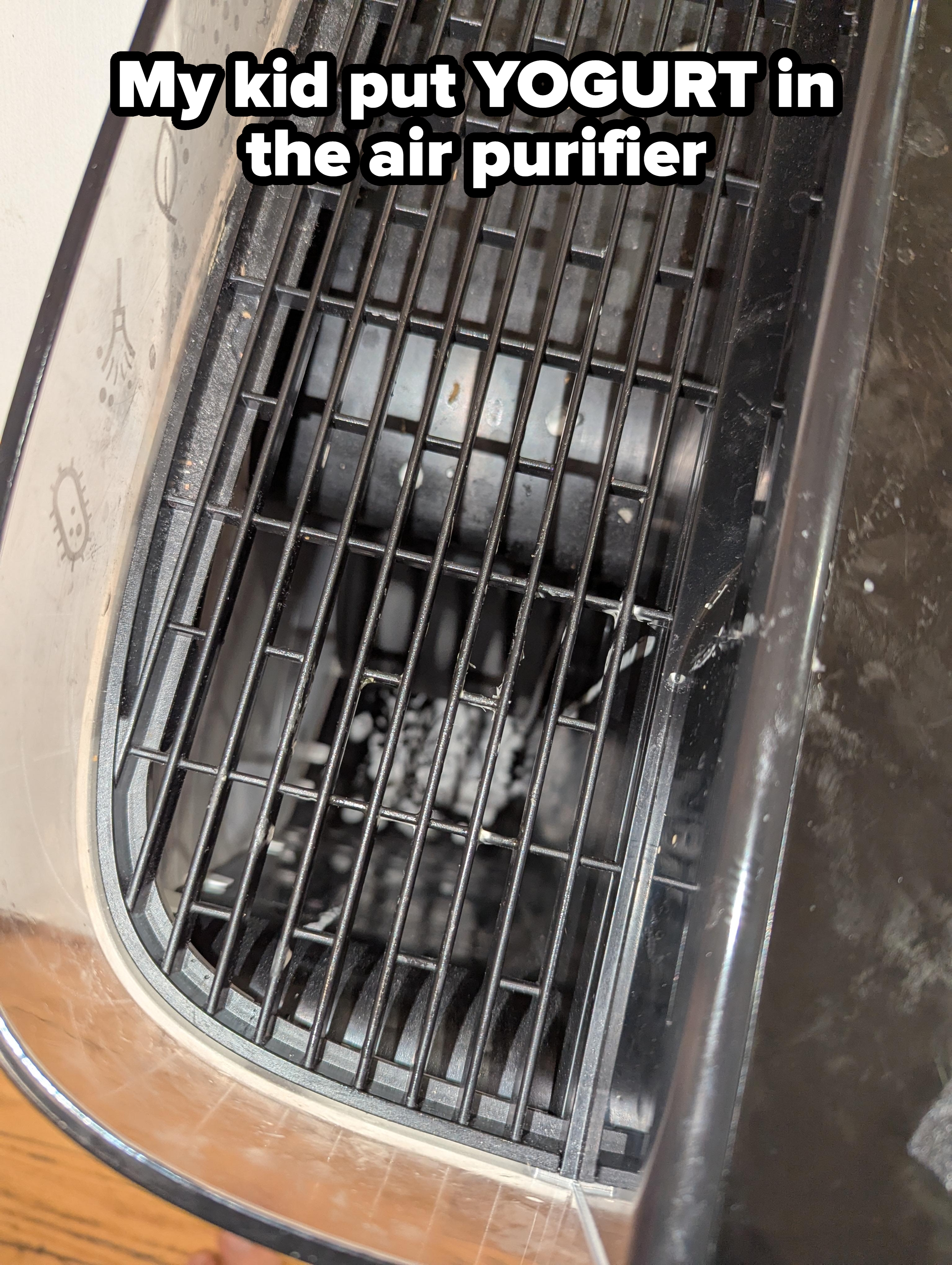 Close-up of an air purifier fan with dust buildup on the grates