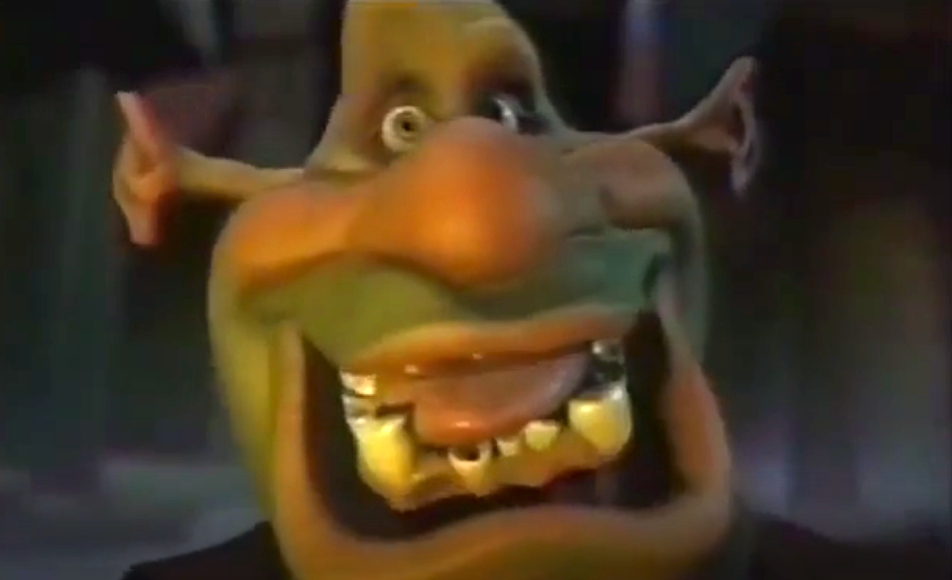 Creepy animated character with exaggerated facial features, including a wide grin, large nose, and crooked teeth