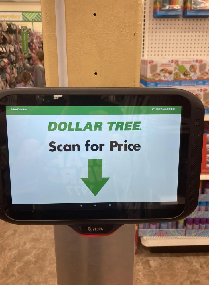 Tablet screen in a store reads: "Dollar Tree. Scan for Price" with a down arrow, indicating where to scan items for pricing