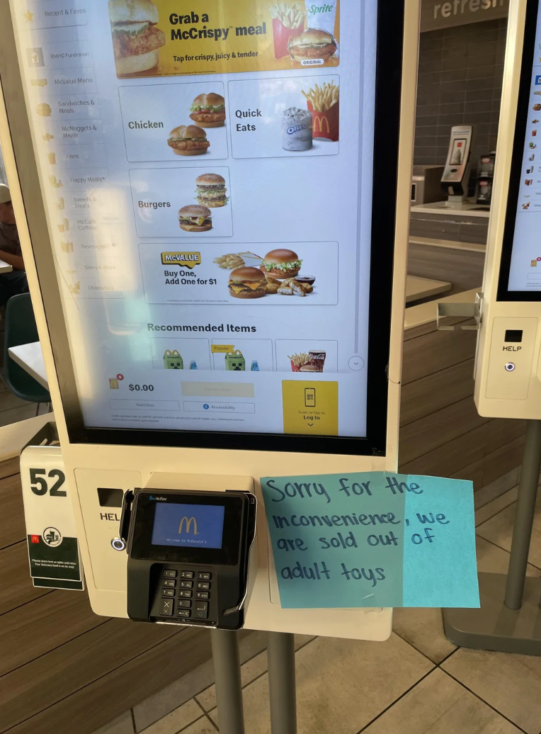 McDonald's self-service kiosk with a sticky enactment      reading, "Sorry for the inconvenience, we are sold retired  of big  toys."