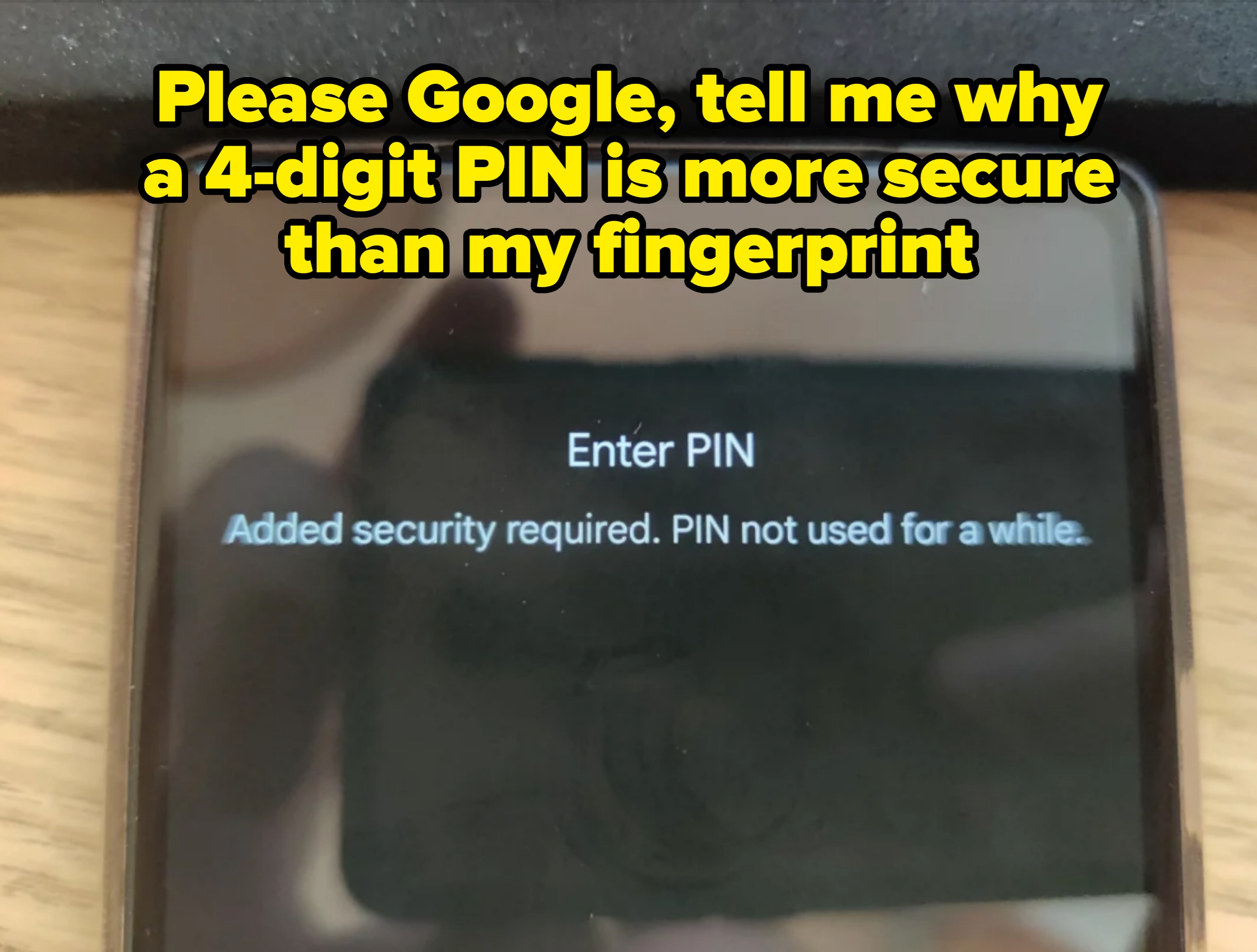 Phone screen displaying a prompt: "Enter PIN. Added security required. PIN not used for a while." Caption: "Please Google, tell me why a 4-digit PIN is more secure than my fingerprint"