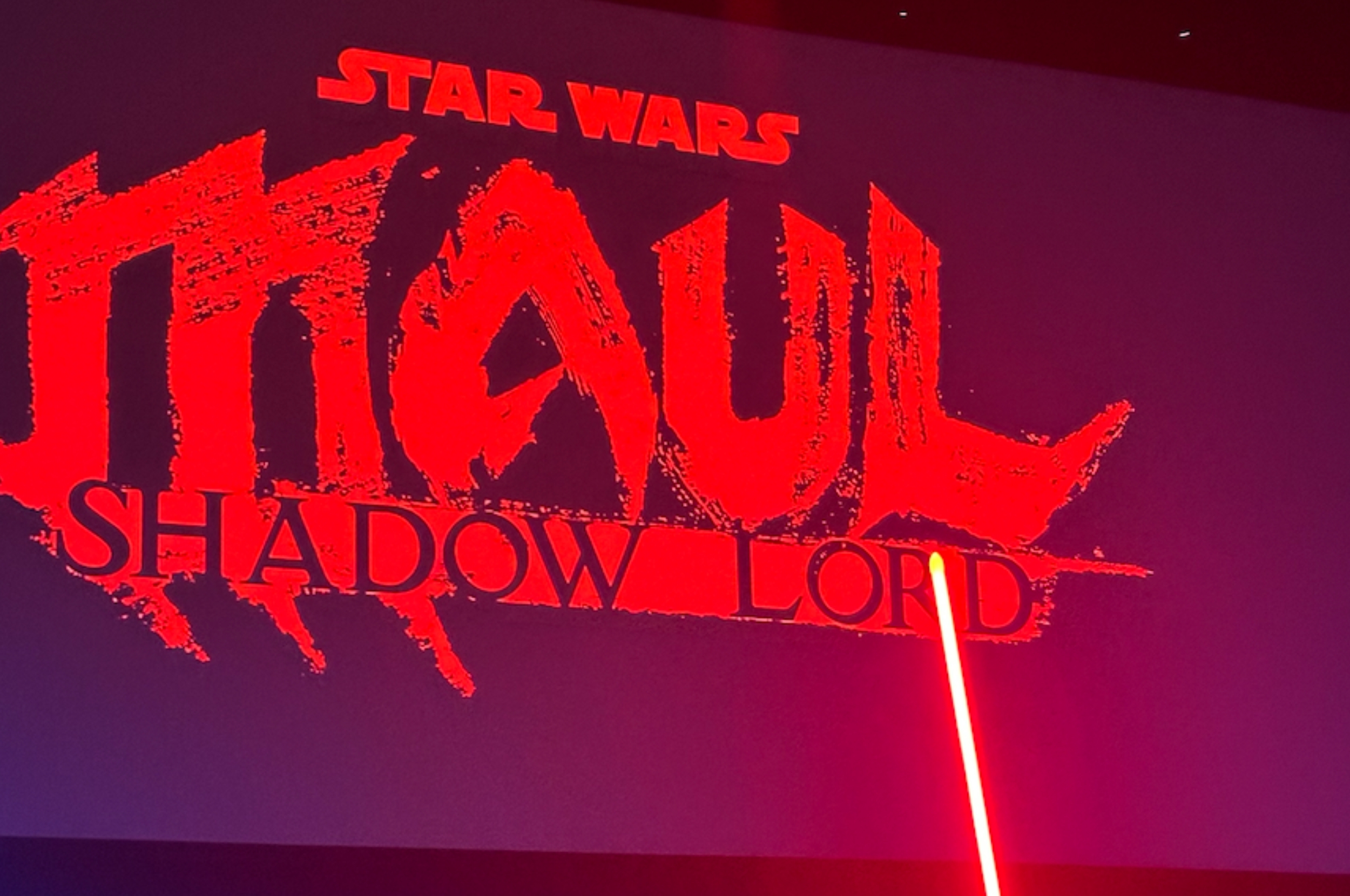 Poster for "Star Wars: Maul – Shadow Lord" showcasing the title with dramatic text and a red lightsaber effect