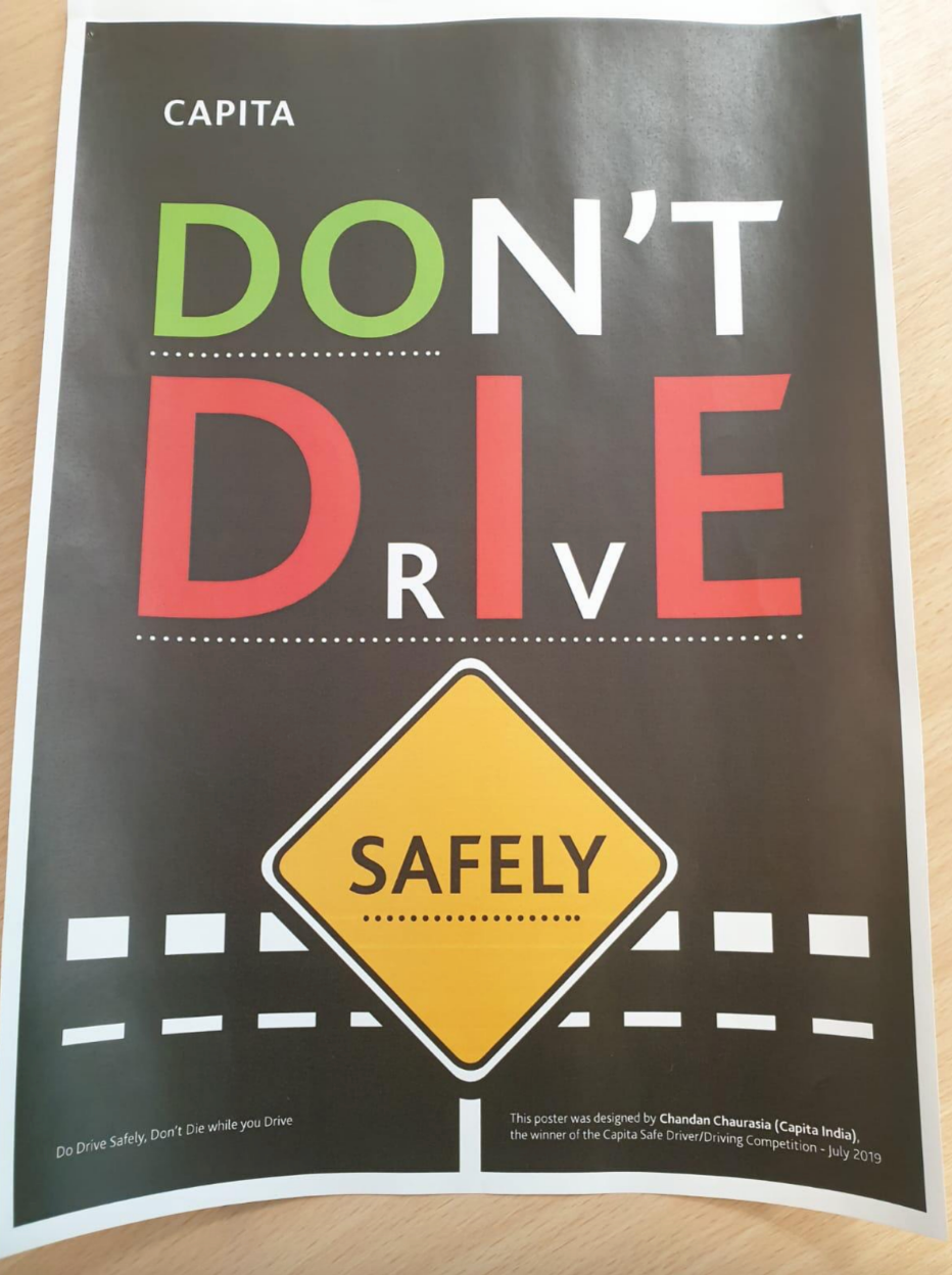 Poster with traffic sign: "Don't Drive Safely" highlighting "Die" in red letters, urging careful driving. Design by Chandana Chaurasia, July 2019