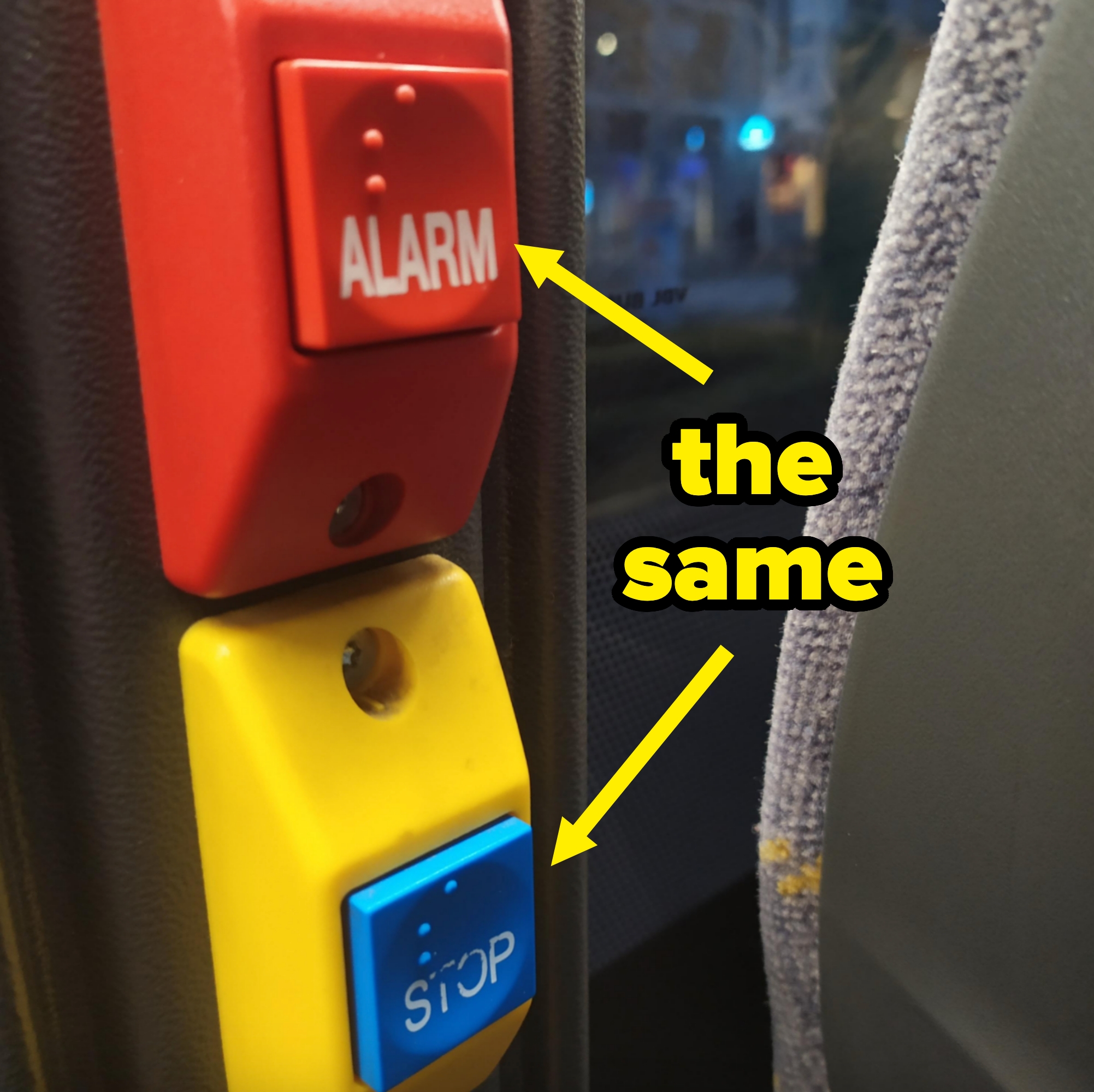Bus buttons with alarm and stop functions, featuring tactile Braille on a public transport vehicle