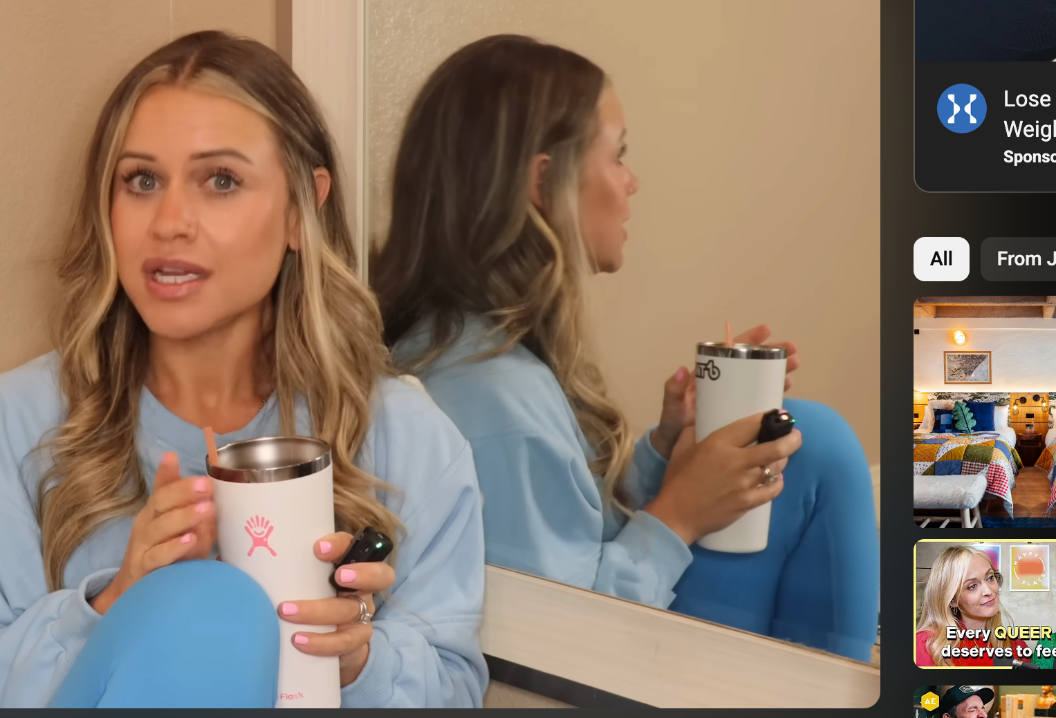 Janelle Rohner speaking in a YouTube video