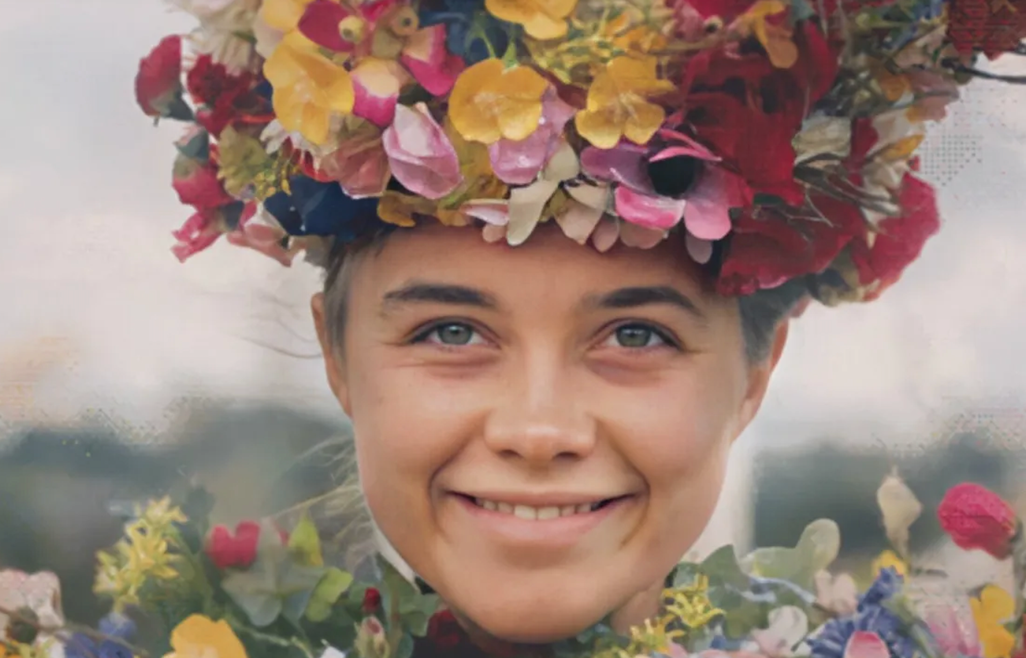 Person wearing a crown made of colorful flowers, smiling directly at the camera