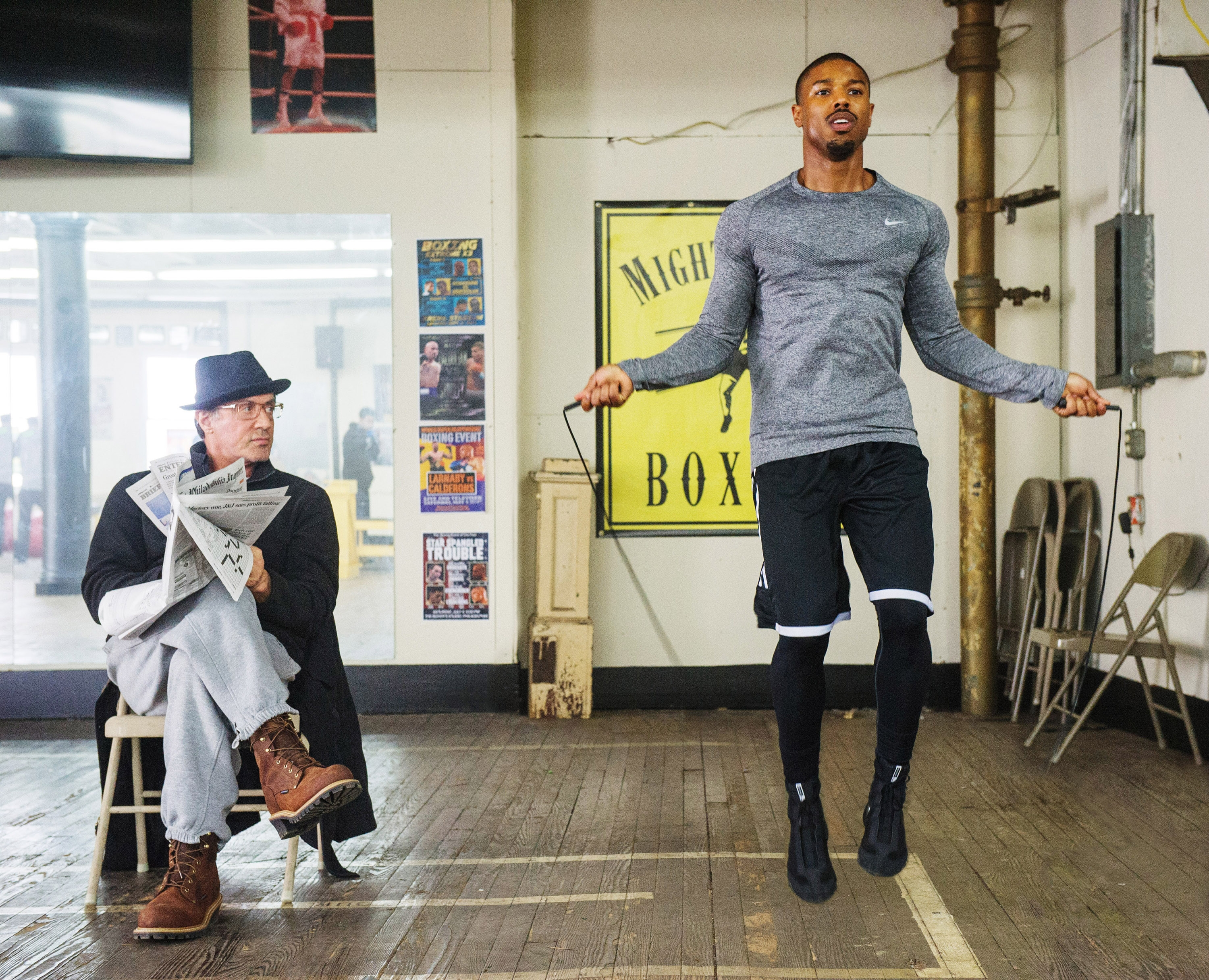 Sylvester Stallone and Michael B. Jordan in a gym setting in "Creed."