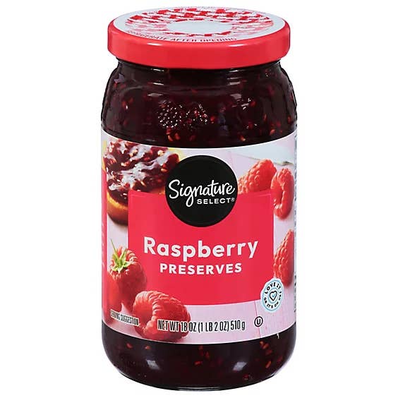 Jar of Signature SELECT raspberry preserves with images of raspberries and toast on the label