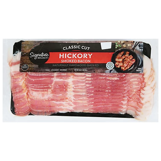 Package of Signature SELECT Hickory Smoked Bacon labeled "Classic Cut," showing several strips of bacon in vacuum-sealed packaging