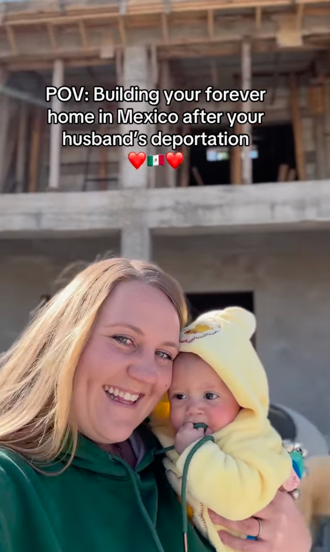 Smiling woman holds baby in front of a partially constructed house. Text discusses building a home in Mexico post-deportation, with heart emojis