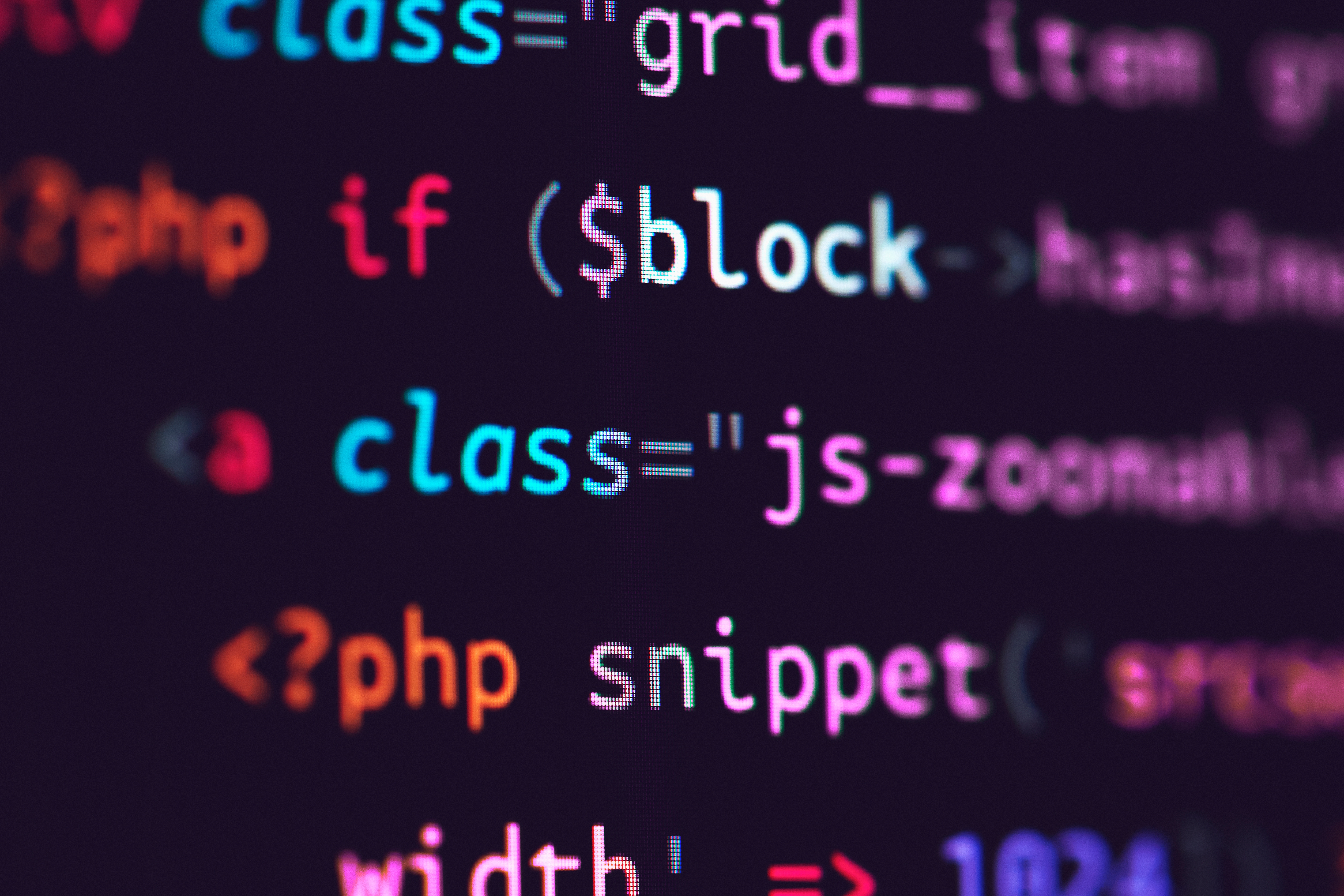 Close-up of highlighted PHP and JavaScript code on a screen