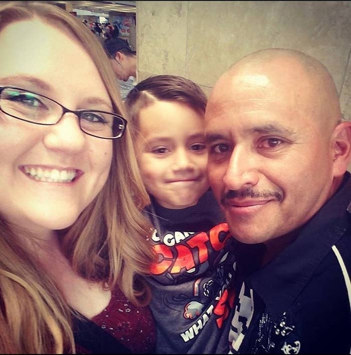 A happy family takes a selfie, smiling and posing together