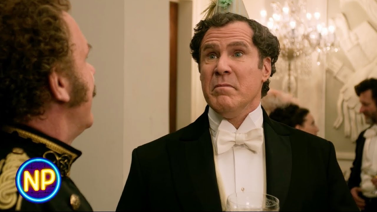 Two people talking at a formal party. One wears a tuxedo with a white bow tie and has a party hat. People are mingling in the background