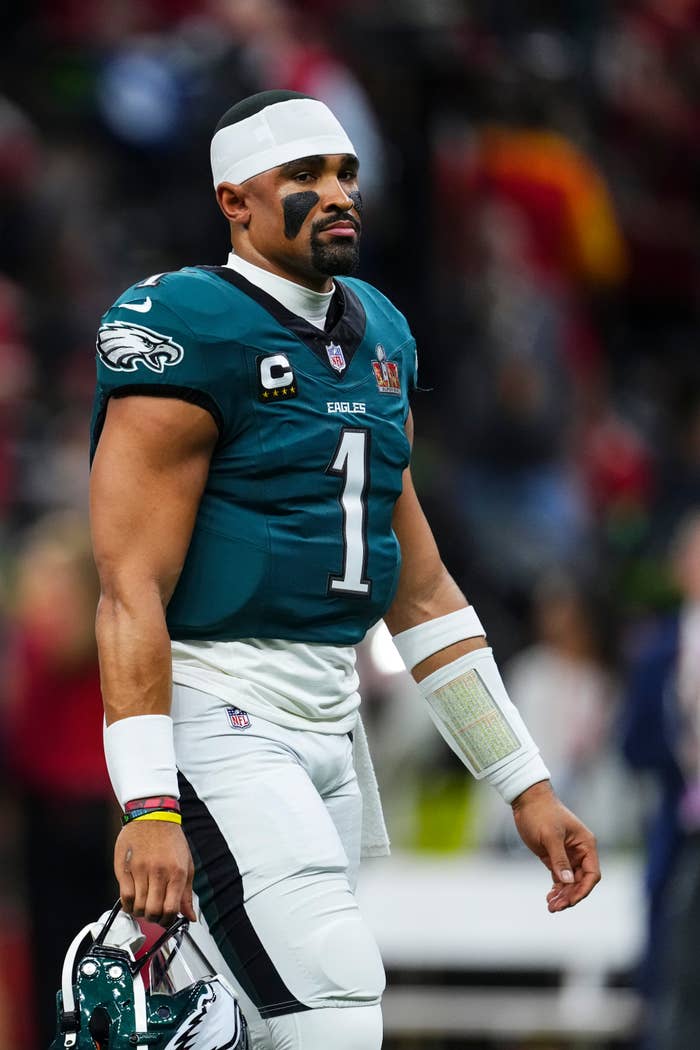 Jalen Hurts on a football field in uniform