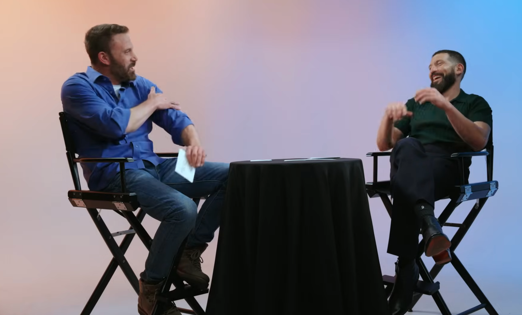 Ben Affleck & Jon Bernthal sitting at a table during an interview