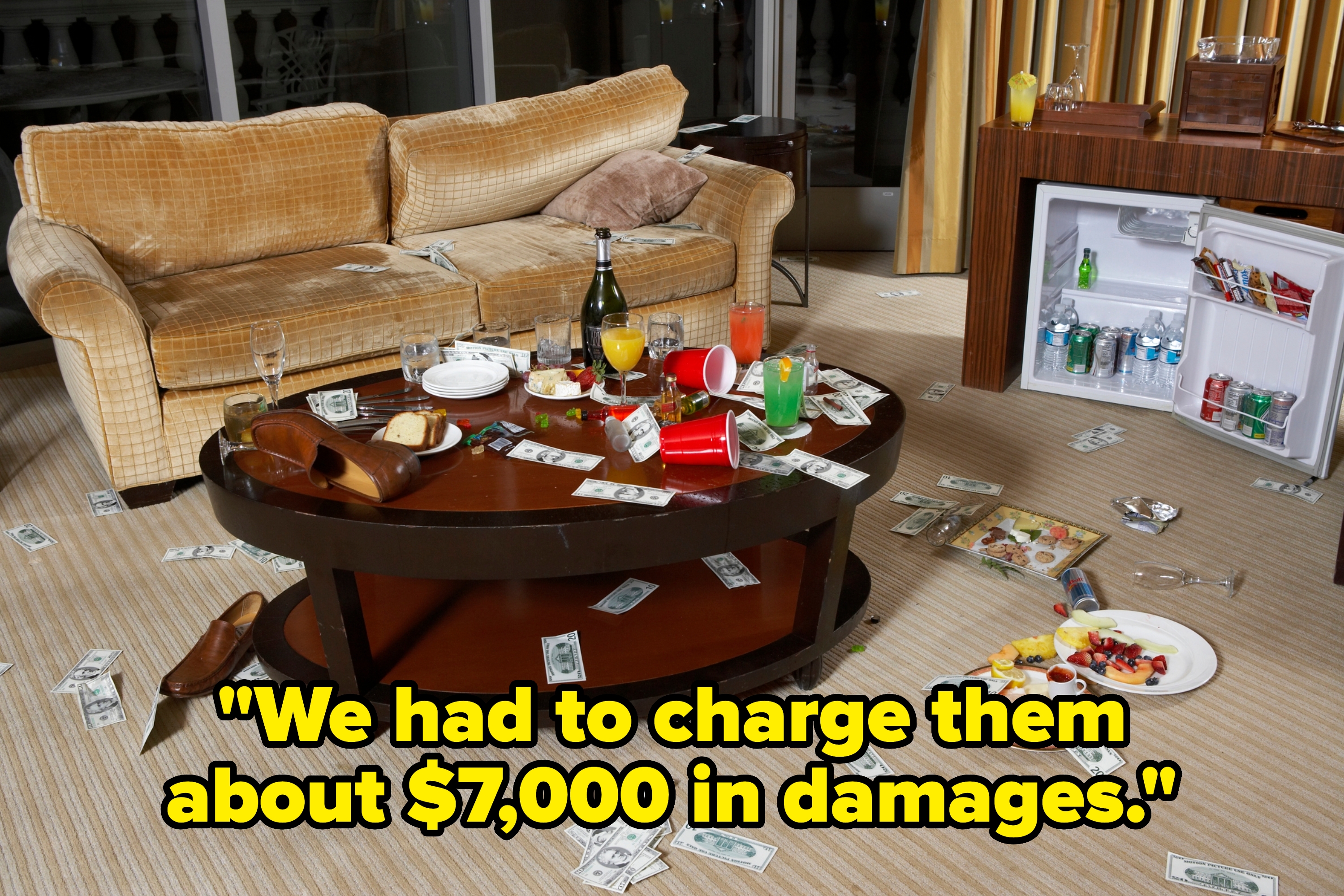 Room with a messy table covered in food, drinks, and cash, with a sofa and open mini fridge