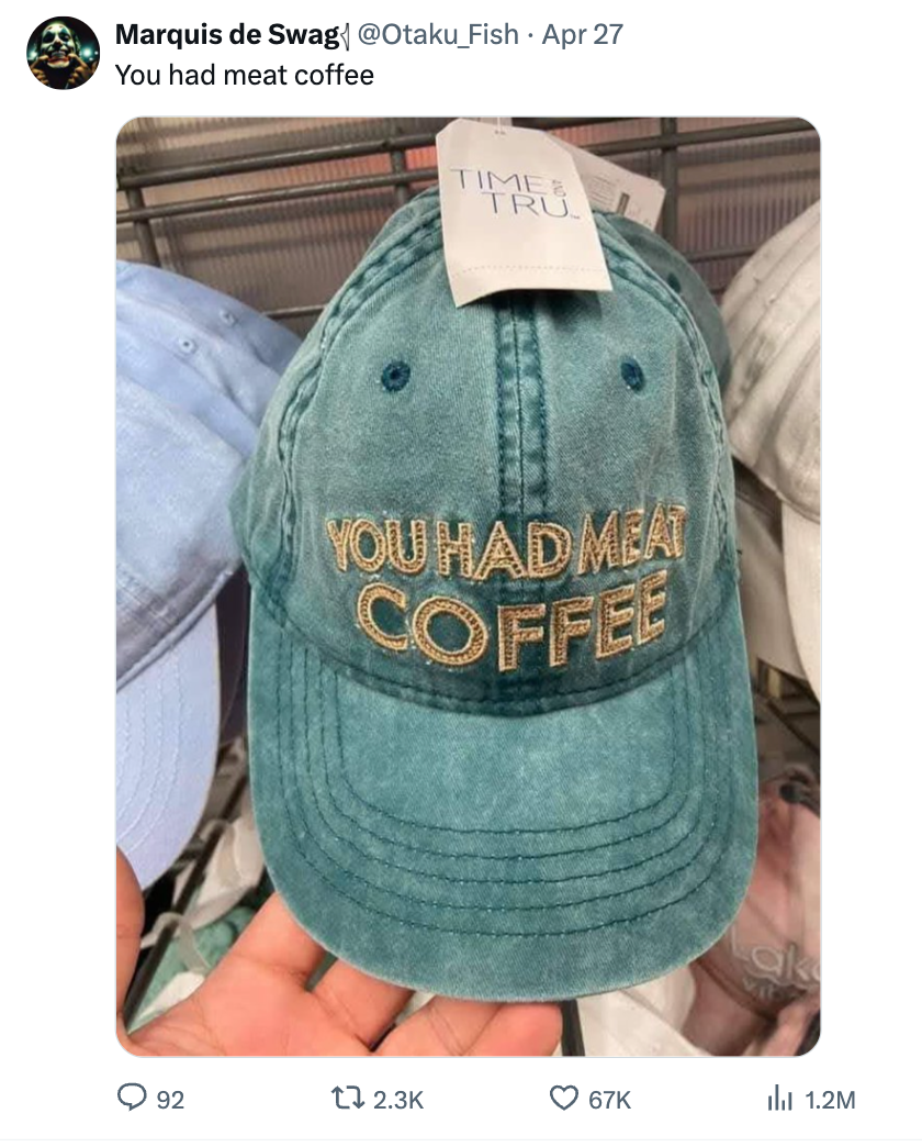 A cap with the text &quot;YOU HAD ME AT COFFEE&quot; is displayed for sale