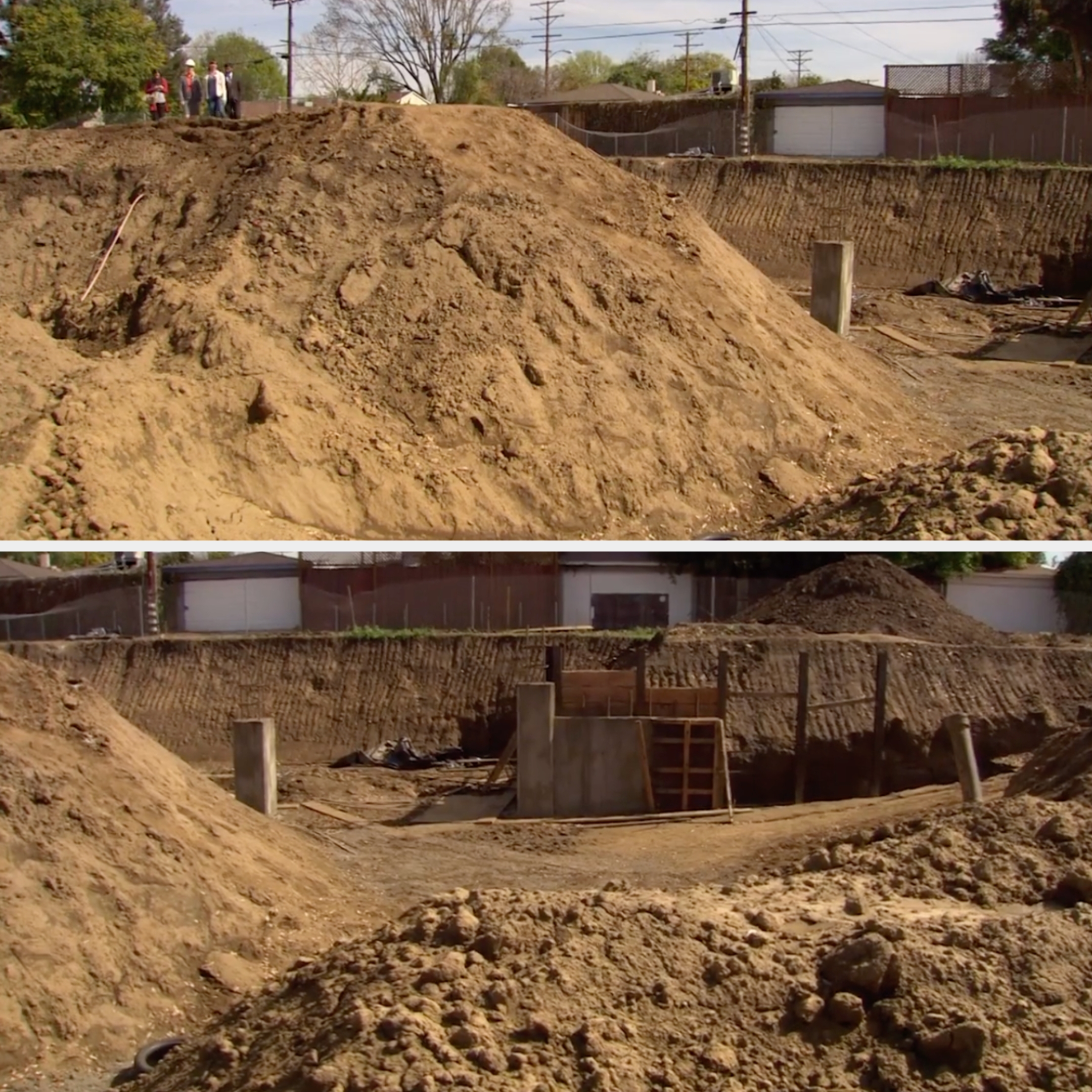 Large dirt mound at a construction site with visible concrete pillars and minimal equipment. People are observing from the top of the mound