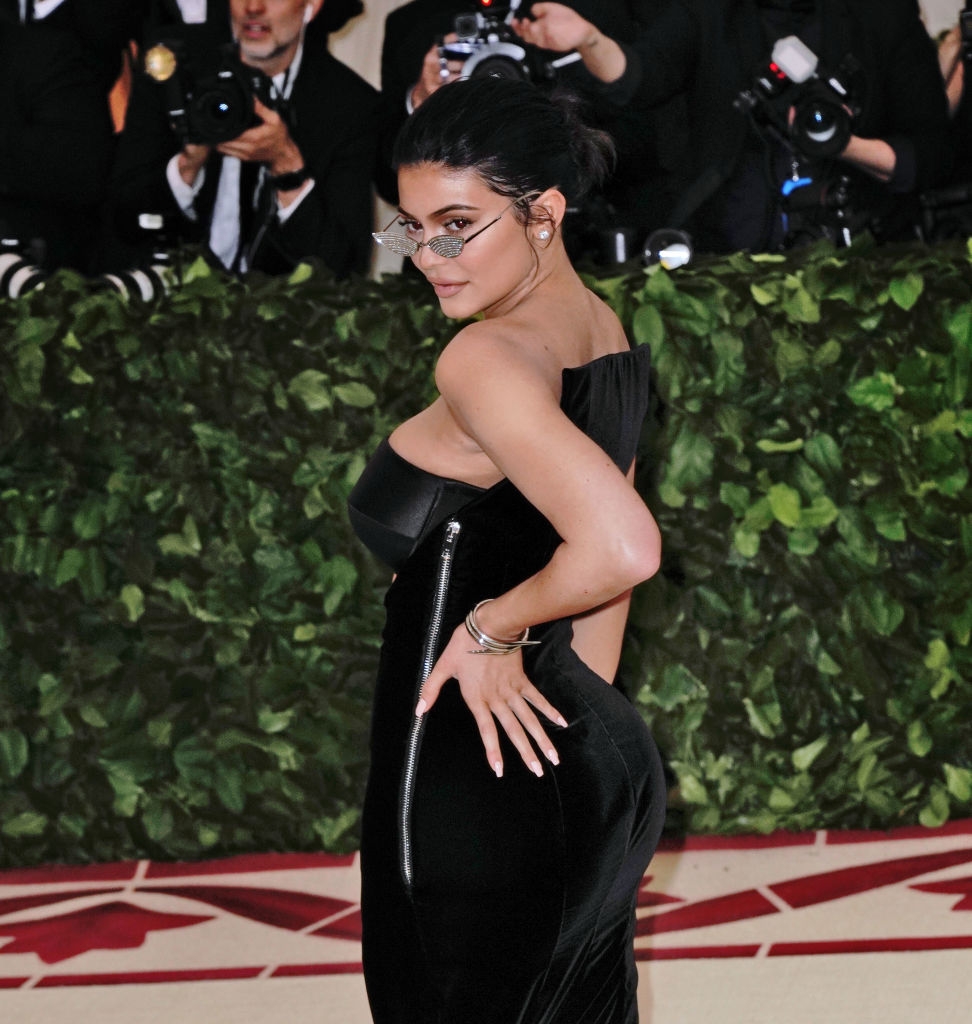 Kylie in a sleek, strapless gown with a zipper that goes from just under her armpit to the top of her thigh