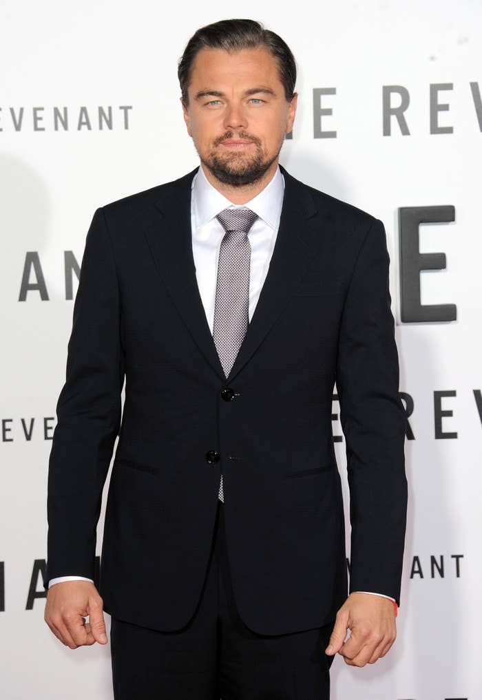 Man in a formal suit with a tie at a film premiere event