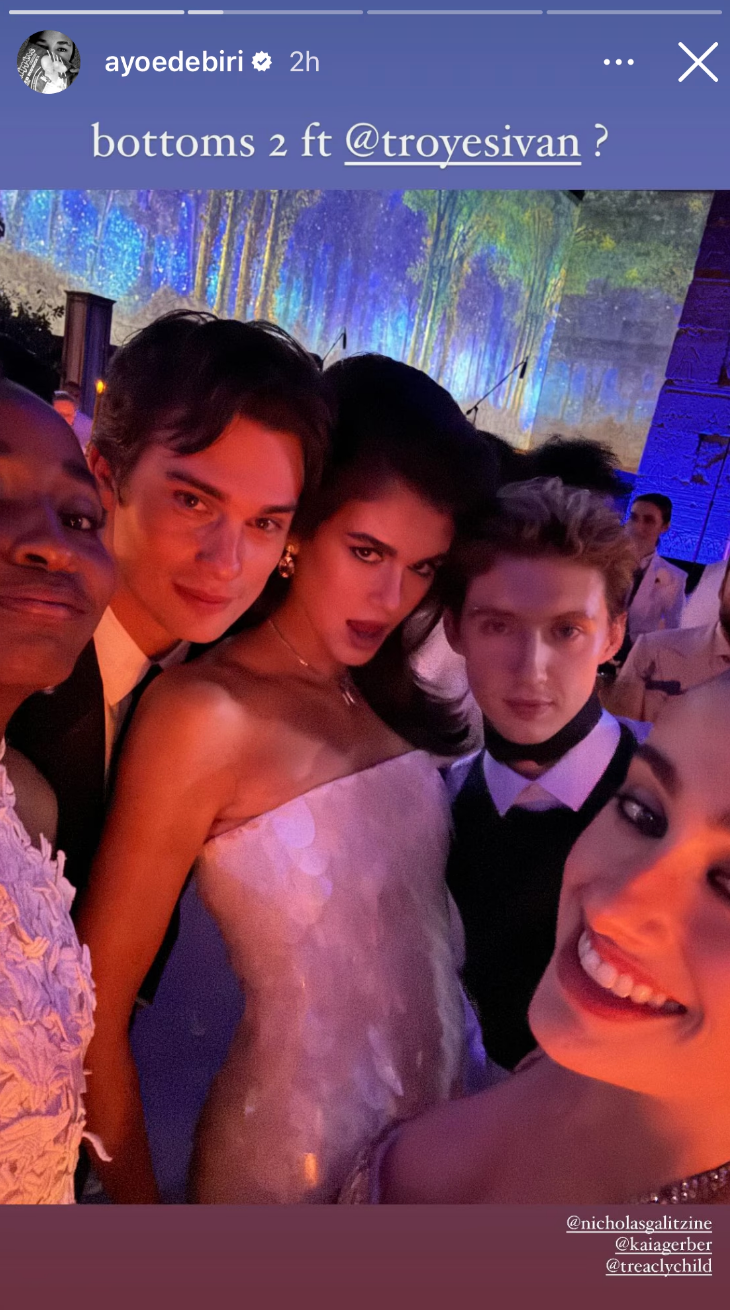 the group posing for a selfie, stylishly dressed for the occasion. Text: "bottoms 2 ft @troyesivan?"