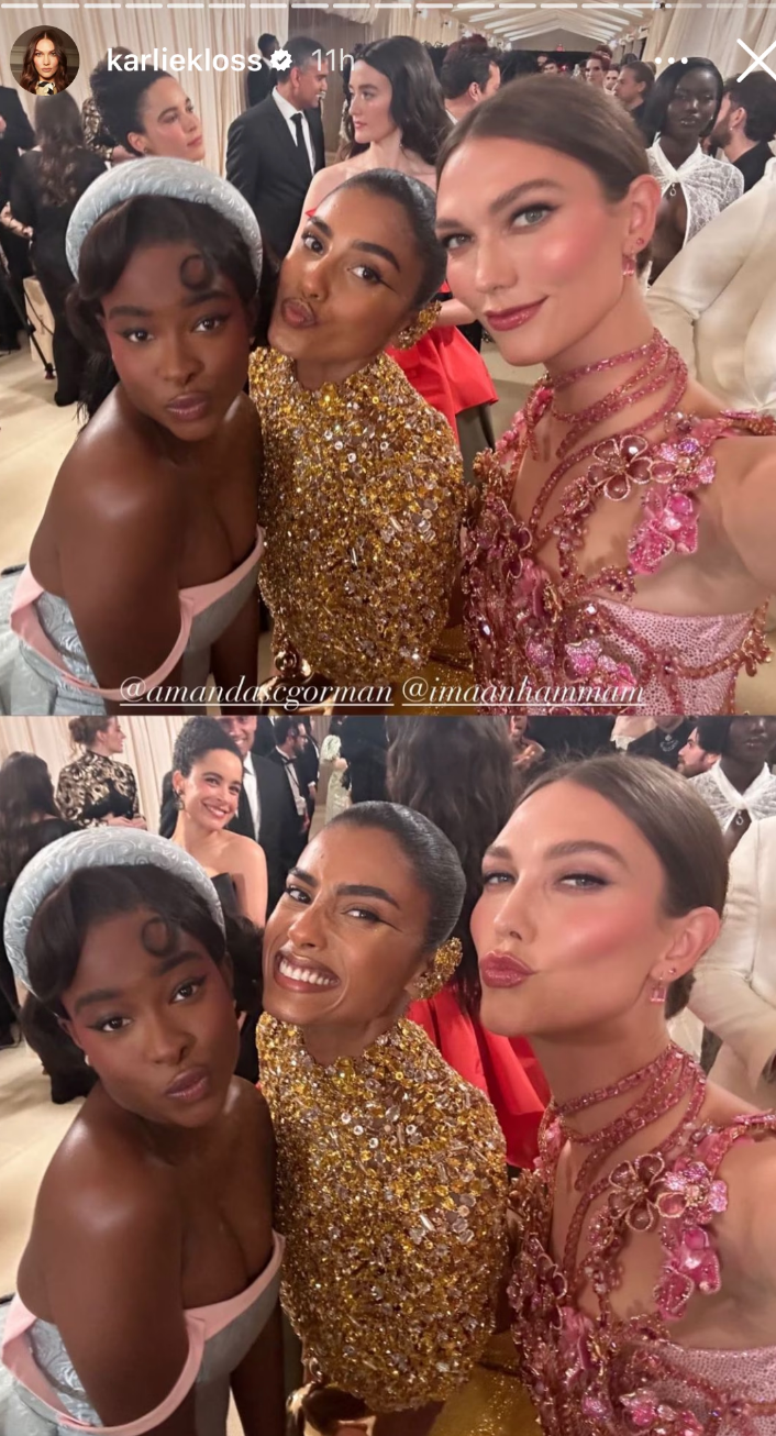 The three woman in elaborate gowns, posing for a selfie